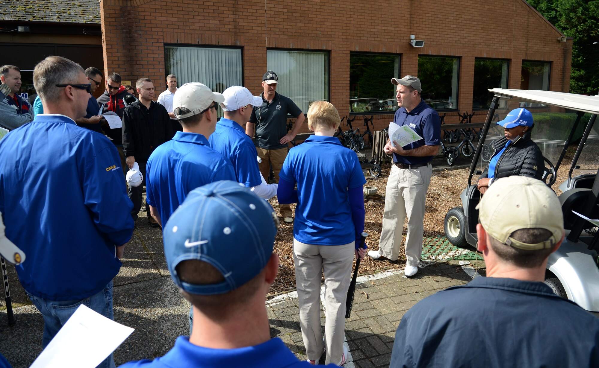 U.S. Air Force Col. Kenneth T. Bibb Jr., second from right, 100th Air Refueling Wing commander, speaks to participants of the Chiefs vs. Eagles golf tournament Sept. 24, 2014, at the Breckland Pines Golf Club on RAF Lakenheath, England. The tournament raised more than $200 for the Combined Federal Campaign and provided an opportunity to build partnerships and encourage morale across Team Mildenhall.  (U.S. Air Force photo/Airman 1st Class Dillon Johnston/Released)