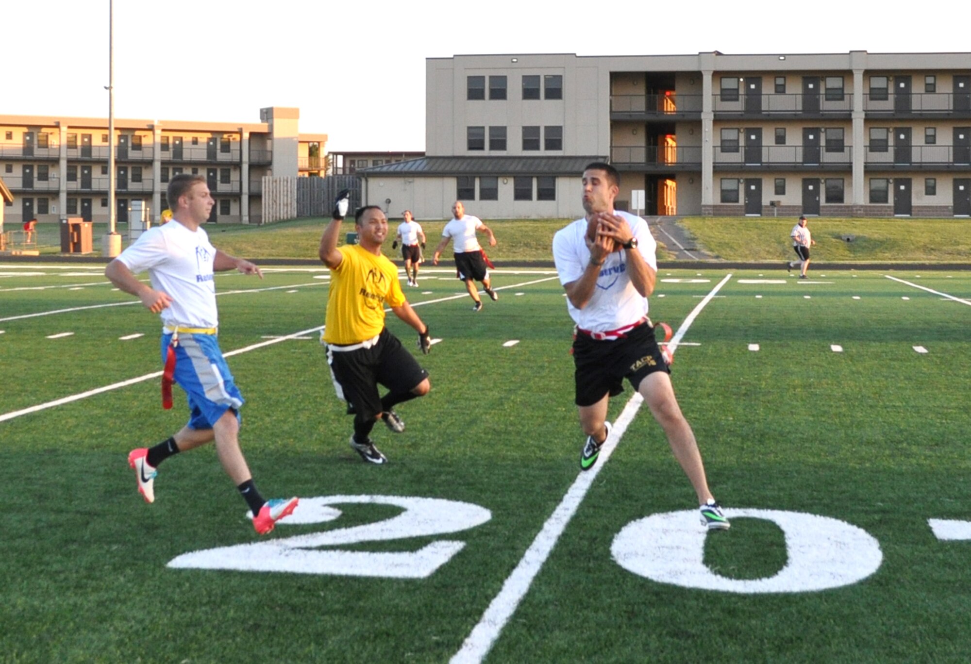 Larry Mansell intercepts a Randy Schell pass with Brett Nims (Reserve White), left, and Henry Pope (Reserve Gold), center, looking on. White upset Gold 18-0. The regular seasons began this week for intramural soccer and flag football. Football games will start at 5, 6, 7 and 8 p.m. on Tuesdays and Thursday each week, with the season ending Nov. 20. Soccer matches are scheduled for Mondays and Wednesdays and will begin at 5, 6:15 and 7:30 p.m. All games are held at the sports field north of the dorms. (Air Force photo by John Parker)