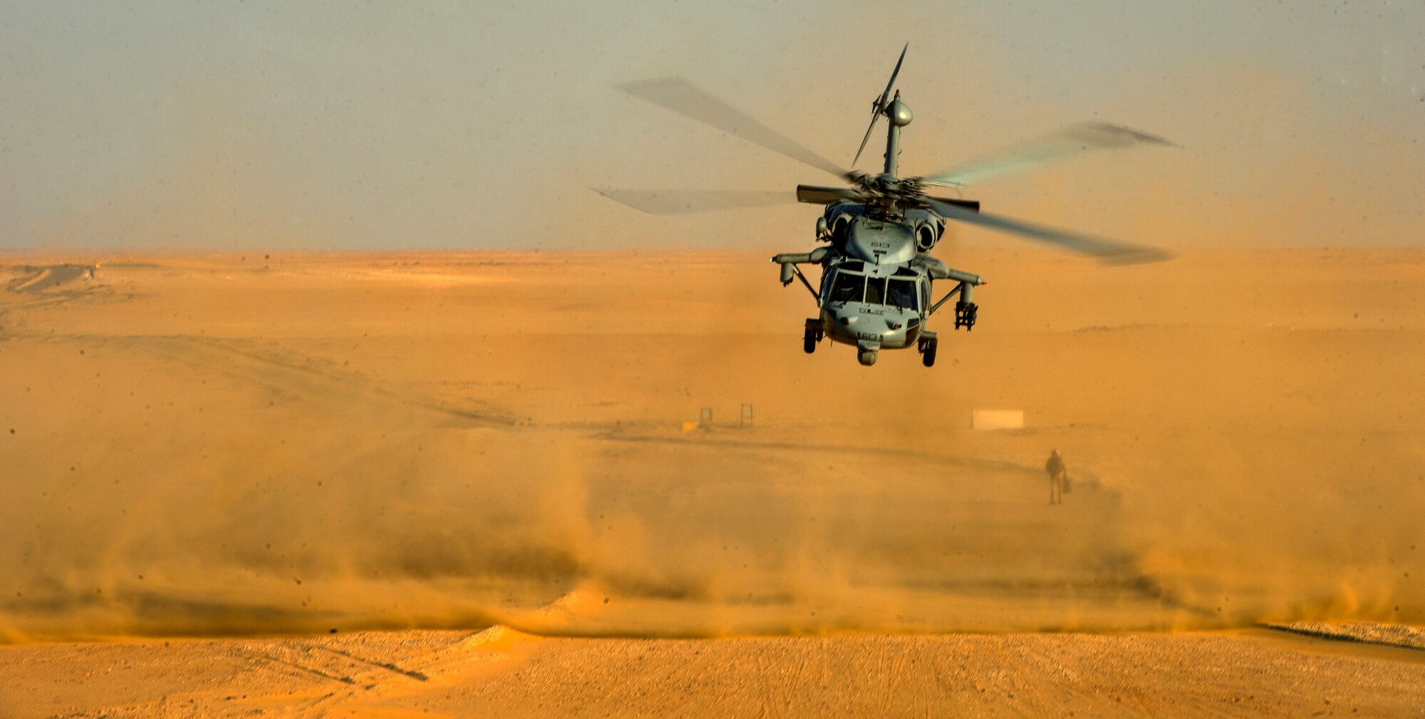 A U.S. Navy MH-60S Seahawk prepares to takeoff during a training exercise led by 82nd Expeditionary Air Support Operations Squadron joint terminal attack controllers July 8, 2014. U.S. Air Force JTACs led training to teach infantry soldiers how to properly communicate with aircraft to coordinate airstrikes in the absence of a tactical air control party Airman. (U.S. Air Force photo by Staff Sgt. Vernon Young Jr.)