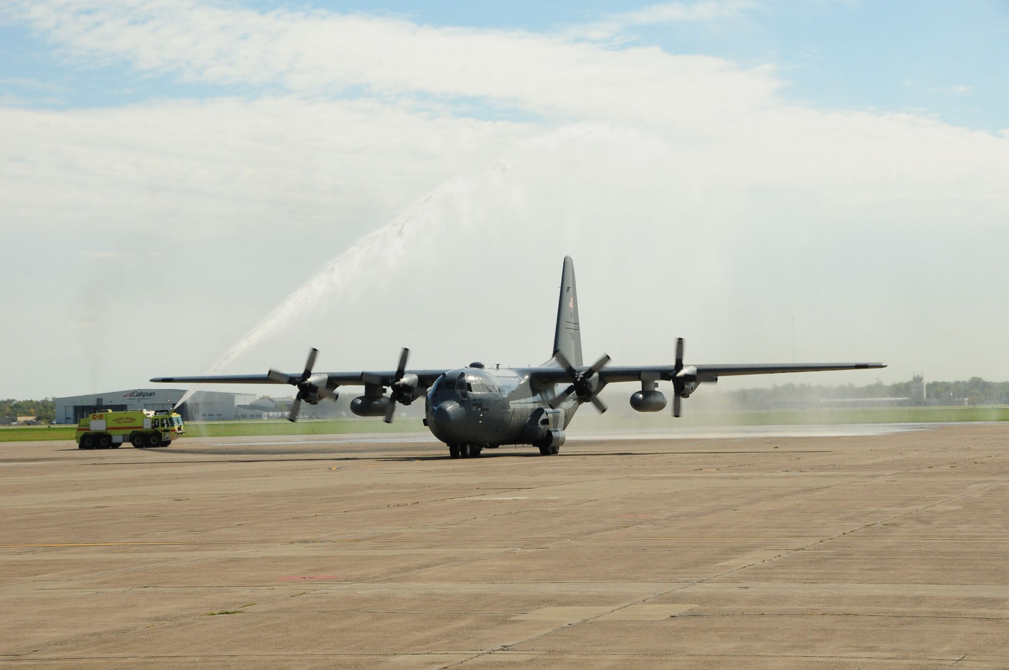 A C-130 aircraft receives a "water salute" after returning from its final flight by a crew from the New York Air National Guard's 107th Airlift Wing to Niagara Falls Air Reserve Station in Niagara Falls, N.Y. on Thursday, Sept. 25, 2014. It was the last C-130 flight for the 107th Airlift Wing as it converts to MQ-9 operations. (U.S. Air National Guard Photo by Senior Master Sgt. Raymond Lloyd/Released)