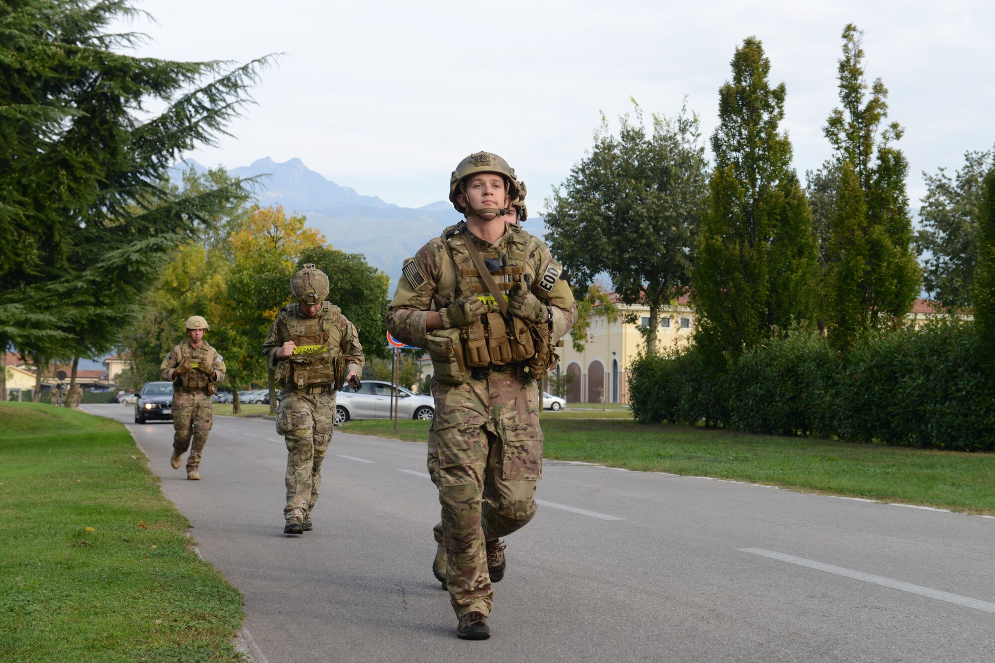 Senior Airman Joseph Schmidt, 31st Civil Engineer Squadron, leads his team during a warrior march, Sept. 26, 2014, at Aviano Air Base, Italy. The Prisoner of War/Missing in Action remembrance week had various events happening throughout the week, to include a memorial run, golf tournament and a balloon release. (U.S. Air Force photo/Airman 1st Class Ryan Conroy)