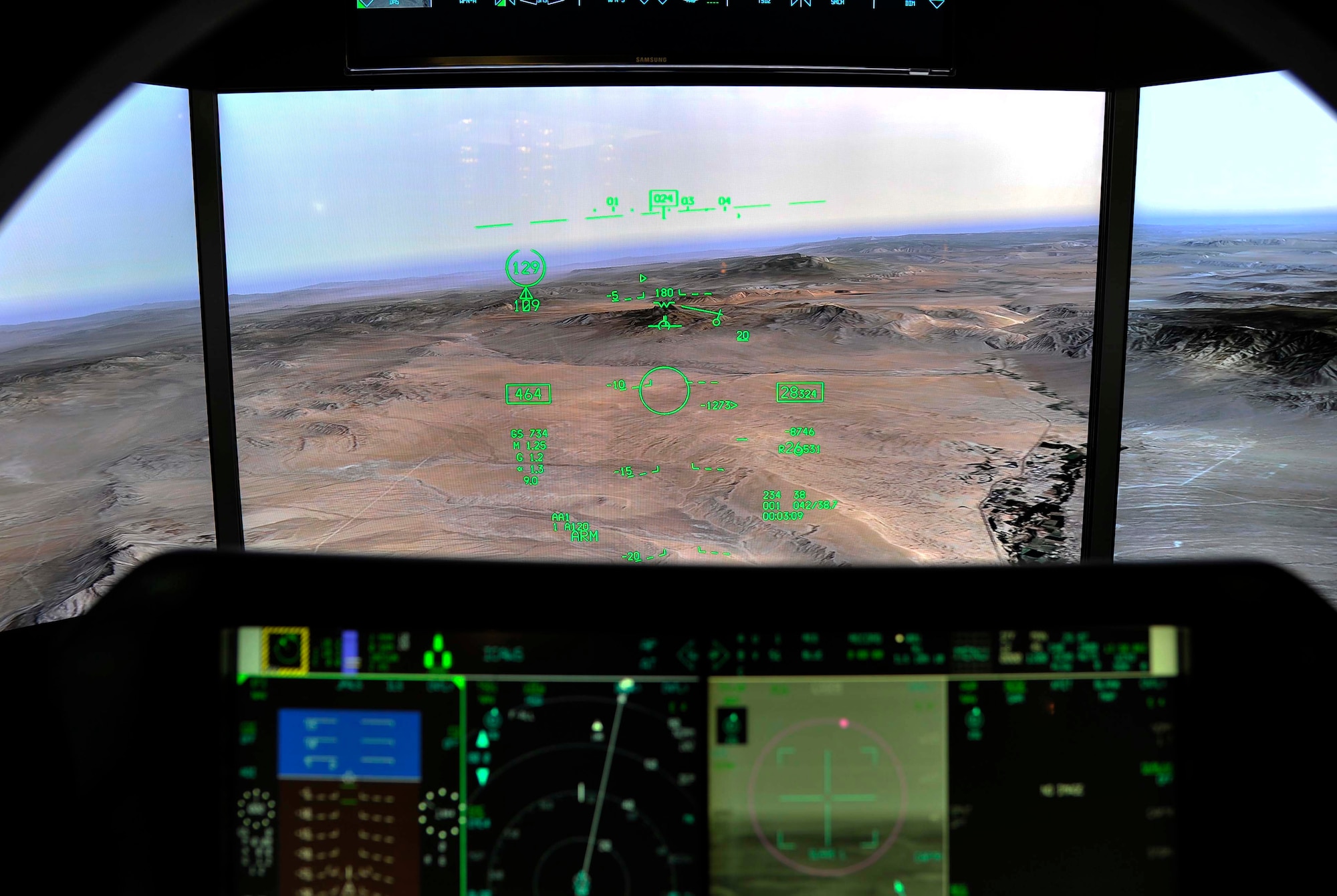 A virtual mission is flown from the simulated cockpit of an F-35 Lightning II demonstration at Misawa Air Base, Japan, Sept. 25, 2014. The view from the seat of the F-35 displayed radars, incoming transmissions and potential targets and offered scenarios including take-offs, landings and engaging enemy aircraft. (U.S. Air Force photo by Airman 1st Class Patrick S. Ciccarone/Released)

