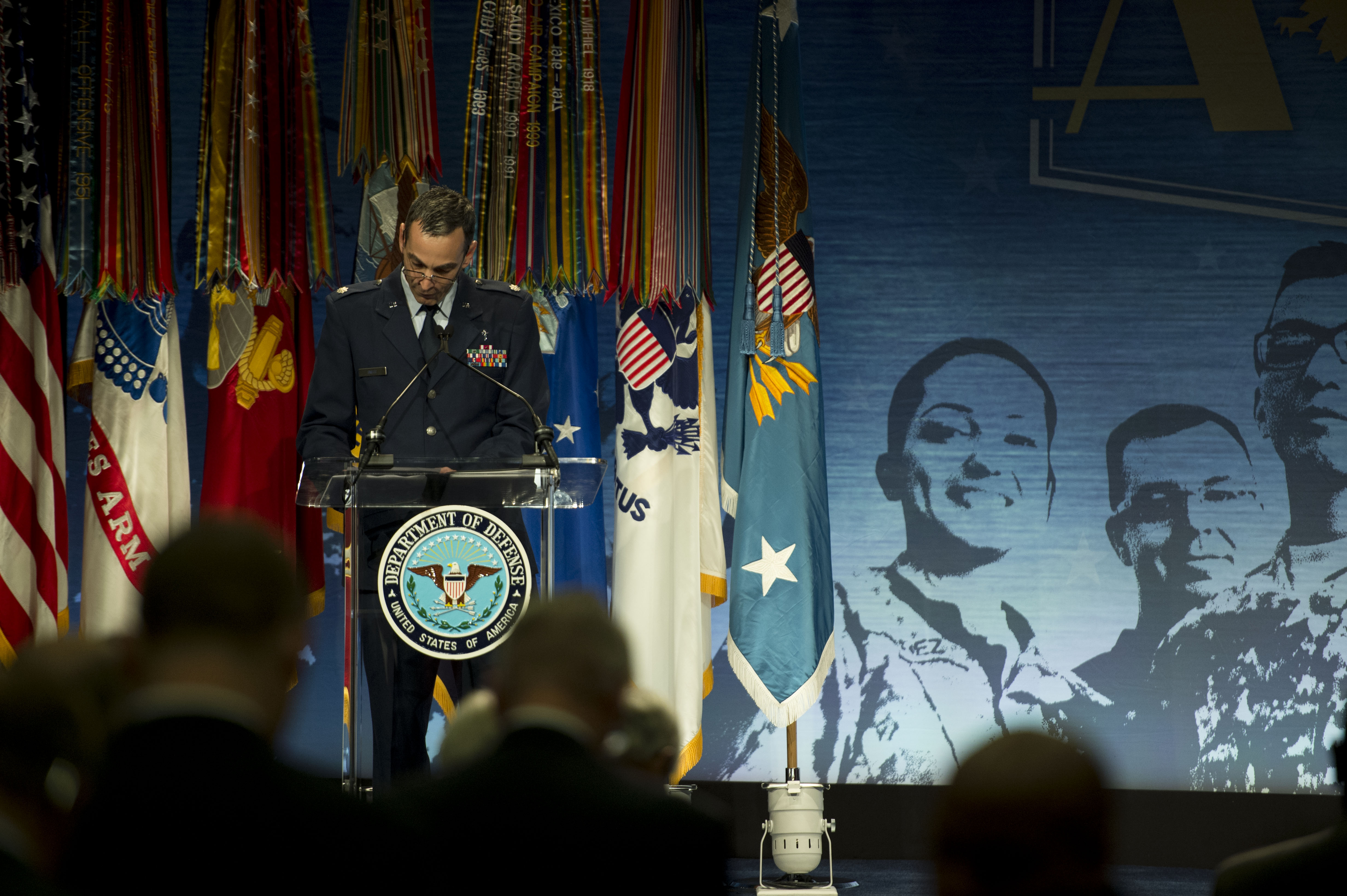 An Air Force chaplain gives the invocation during the Secretary of