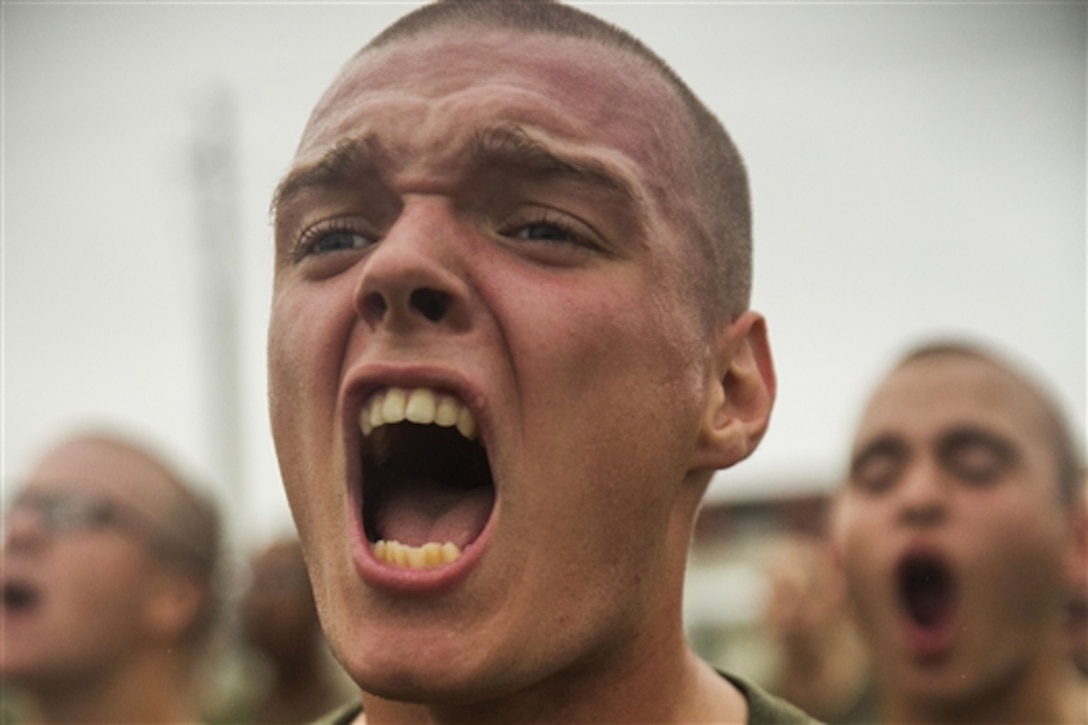 Marine recruit John Sullivan responds to drill instructors at Marine Corps Recruit Depot Parris Island, S.C., Sept. 25, 2014.