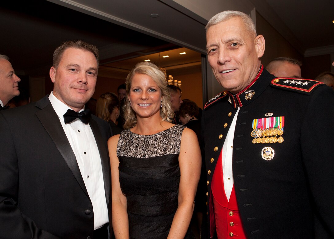 The Assistant Commandant of the Marine Corps, Gen. John M. Paxton, Jr., right, poses for a photo during the reception before the Modern Day Marine Grand Banquet in Arlington, Va., Sept. 24, 2014. (U.S. Marine Corps photo by Cpl. Tia Dufour/Released)