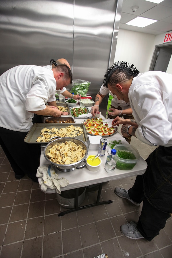 NEW YORK CITY—Staff Sgt. Jesse Costa, 1st Marine Corps District’s Club Manager, alongside other chefs prepares the dishes for Club Space NYC, Sept. 18. Costa is on the path to becoming the only chef in his military occupational specialty. (U.S. Marine Corps photo by Lance Cpl. Brandon Thomas)