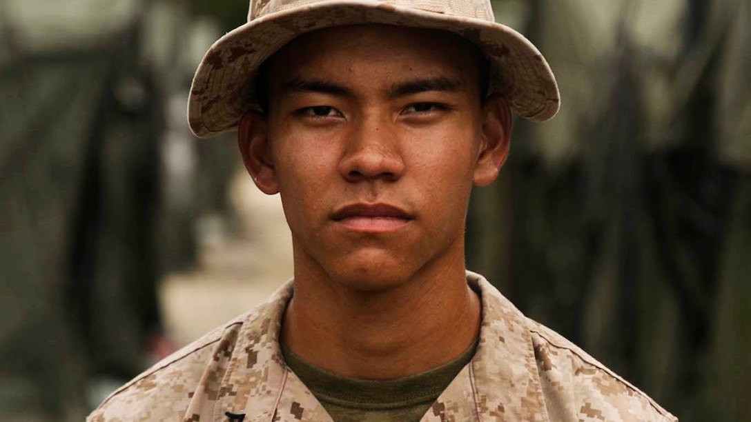 Lance Cpl. Edward Manibusan, Jr., from Koblerville, Saipan, stands outside of his tent Sept. 26 during Exercise Forager Fury III. He was raised in Saipan, located near Tinian, and joined the Marine Corps shortly after graduating high school. Manibusan is a field wireman with Marine Wing Support Squadron 171, Marine Aircraft Group 12, 1st Marine Aircraft Wing, III Marine Expeditionary Force. (U.S. Marine Corps photo by Lance Cpl. Tyler Ngiraswei/ Released)