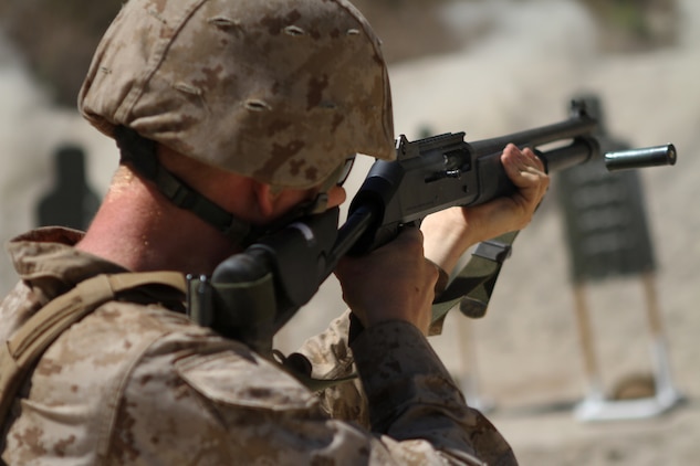 Lance Corporal Colin Stegal, an ammo technician with Ammo Company, 1st Supply Battalion, fires a M1014 shotgun aboard Marine Corps Base Camp Pendleton, Calif., Sept. 15, 2014. The range required Marines to demonstrate proficiency with the M1014 shotgun. The live-fire ranges were part of an annual training package to keep the Marines confident and proficient with each weapon system.