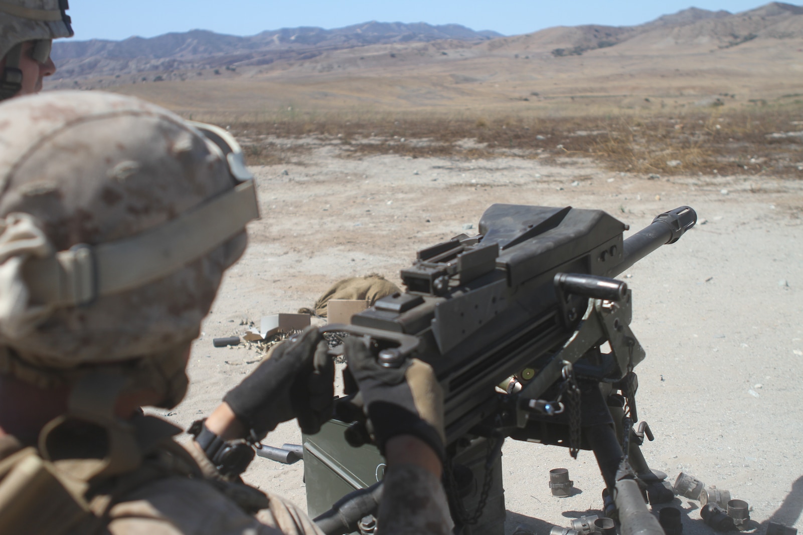 Marines with Ammo Company, 1st Supply Battalion, operate an Mk19 automatic grenade launcher aboard Marine Corps Base Camp Pendleton, Calif., Sept. 17, 2014. The Marines were required to engage simulated targets while conducting the basic machine gun course. The live-fire ranges were part of an annual training package to keep the Marines confident and proficient with each weapon system.