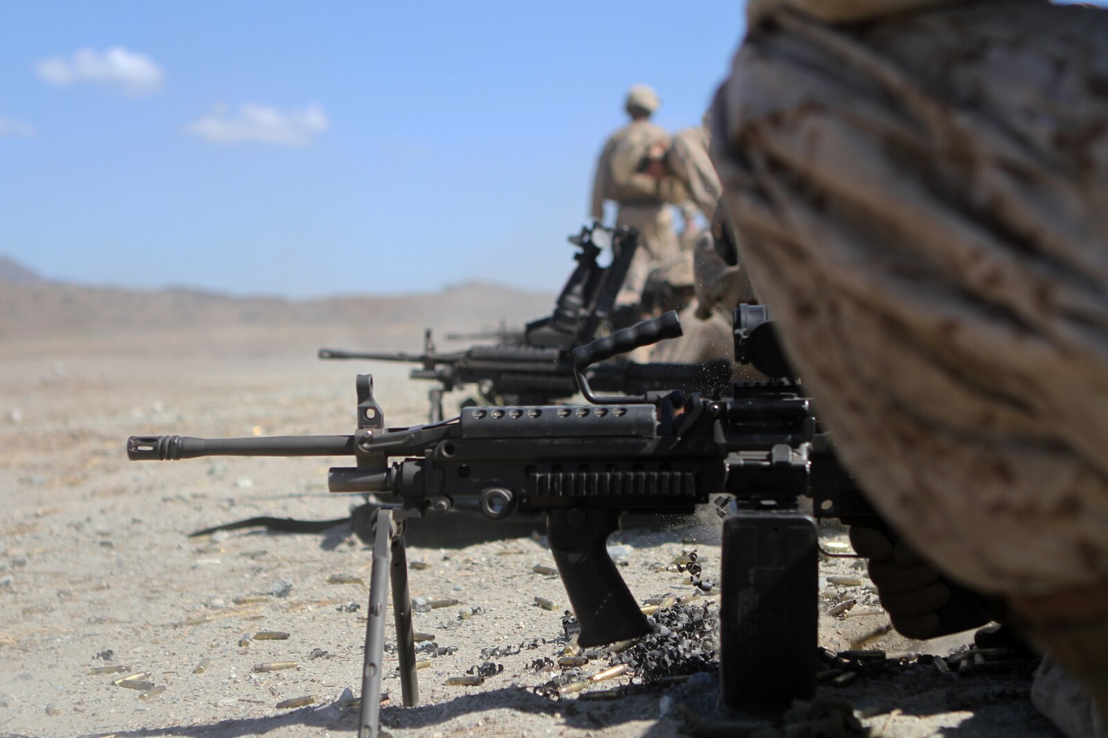 Ammo technicians with Ammo Co., 1st Supply Battalion conduct a basic machine gun range aboard Marine Corps Base Camp Pendleton, Calif., Sept. 17, 2014. The range required the Marines to demonstrate proficiency with M249 SAWs, M240Bs, M2s and Mk19s. The live-fire ranges were part of an annual training package to keep the Marines confident and proficient with each weapon system.