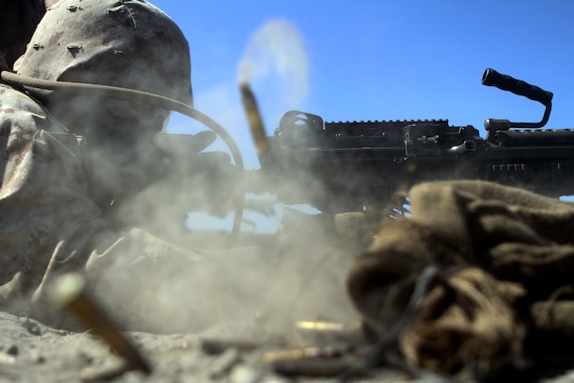 Lance Corporal Dashaun Dancy, an ammo technician with Ammo Company, 1st Supply Battalion fires an M249 SAW aboard Marine Corps Base Camp Pendleton, Calif., Sept. 17, 2014. The Marines were required to engage simulated targets with weapons ranging from M1014 Benelli shotguns to AT-4 rocket launchers. The live-fire ranges were part of an annual training package to keep the Marines confident and proficient with each weapon system.