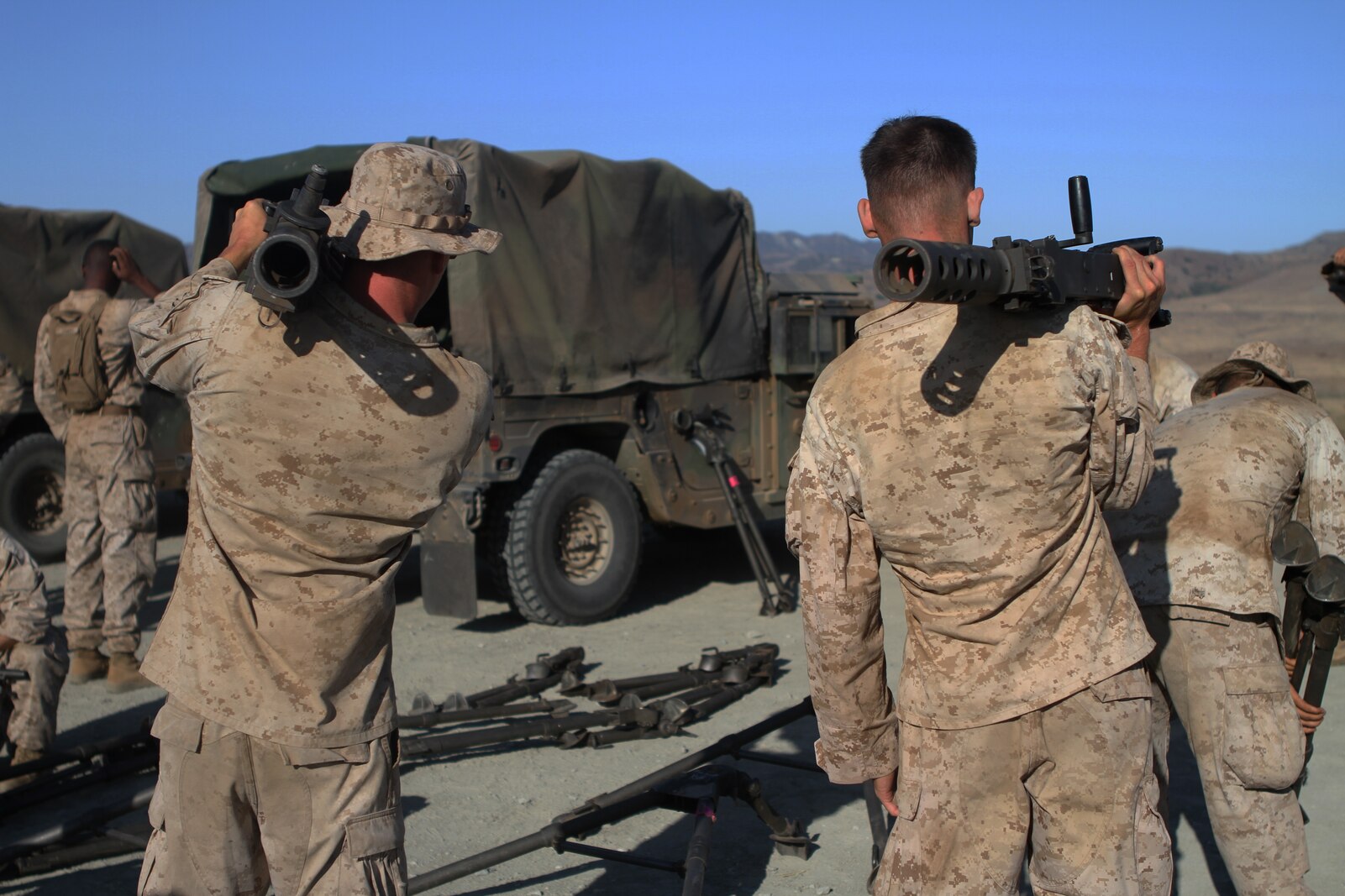 Marines with Ammo Company, 1st Supply Battalion, prepare to fire M2 .50-caliber machine guns aboard Marine Corps Base Camp Pendleton, Calif., Sept. 17, 2014. The range required Marines to demonstrate proficiency with M249 SAWs, M240Bs, M2s and Mk19s. The live-fire ranges were part of an annual training package to keep the Marines confident and proficient with each weapon system.