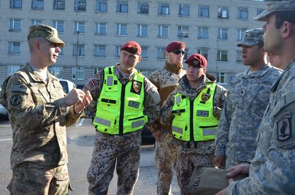 Michigan Army National Guard Sgt. Maj. Edward Williams, with the 210th Military Police Battalion, Taylor, Michigan, helps facilitate traffic accident investigation training along with his Latvian counterparts from the Latvian MP Company, Riga, Latvia, Sept. 23, 2014. The Michigan the Latvian MP’s are training together in support of Operation Silver Arrow, in conjunction with United States Army Europe and Operation Northern Resolve. 