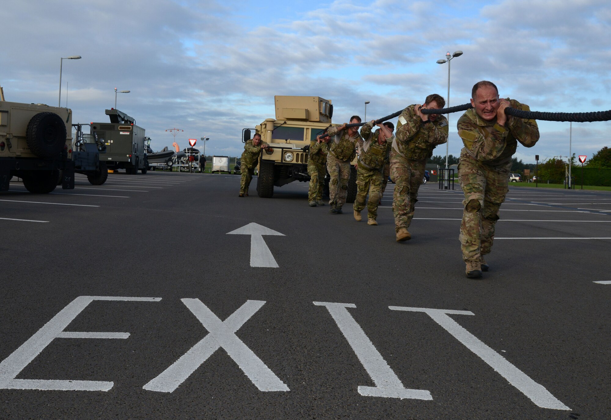 Team 4 from the 321 Special Tactics Squadron pull a Humvee during Monster Mash Sept. 26, 2014, on RAF Mildenhall, England. The Monster Mash consisted of various events such as carrying a Zodiac inflatable boat, marching with a 40-pound rucksack and a blind weapons assembly. A Monster Mash is a long-standing special tactics tradition which combines events designed to test the strength, stamina, and problem solving skills. (U.S. Air Force photo/Tech. Sgt. Stacia Zachary/Released)