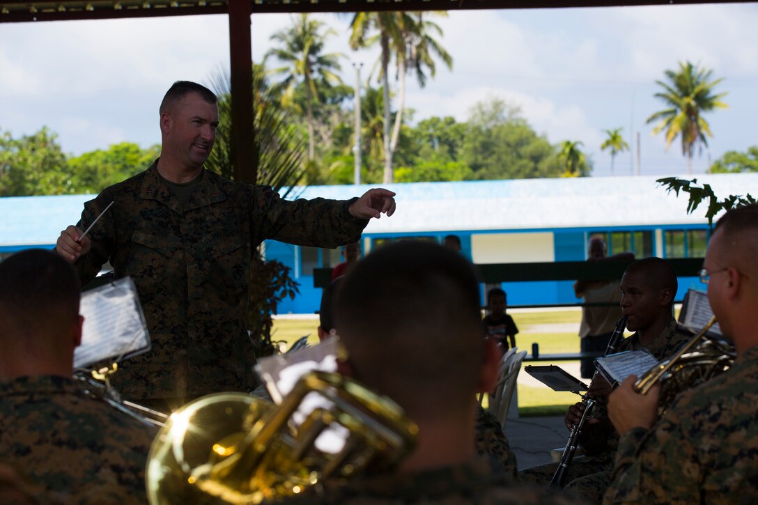 PELELIU, Palau – Chief Warrant Officer 3 Michael J. Smith, band officer for the U.S. Marine Corps Forces, Pacific Band, conducts the band during the opening of the 70th Anniversary ceremony commemorating the landing on Peleliu, Sept. 15. The band performed a series of musical pieces during the ceremony, including “Stars and Stripes” and “The Marines’ Hymn.” (U.S. Marine Corps photo by Cpl. Erik Estrada)