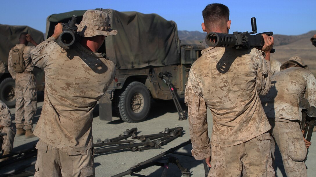 Marines with Ammo Company, 1st Supply Battalion, prepare to fire M2 .50-caliber machine guns aboard Marine Corps Base Camp Pendleton, Calif., Sept. 17, 2014. The range required Marines to demonstrate proficiency with M249 SAWs, M240Bs, M2s and Mk19s. The live-fire ranges were part of an annual training package to keep the Marines confident and proficient with each weapon system.