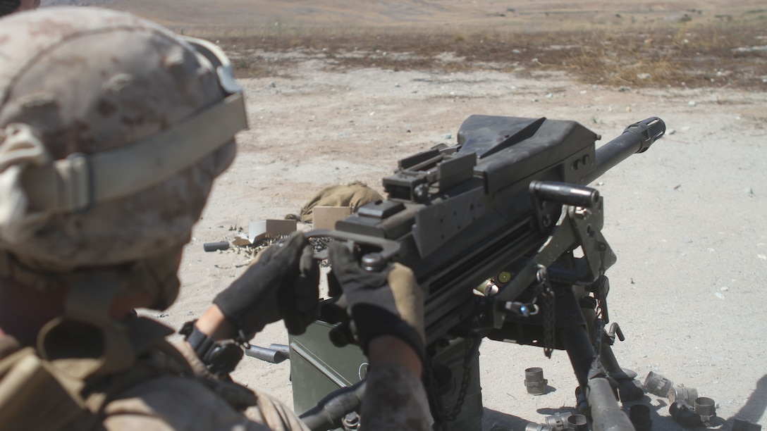 Marines with Ammo Company, 1st Supply Battalion, operate an Mk19 automatic grenade launcher aboard Marine Corps Base Camp Pendleton, Calif., Sept. 17, 2014. The Marines were required to engage simulated targets while conducting the basic machine gun course. The live-fire ranges were part of an annual training package to keep the Marines confident and proficient with each weapon system.