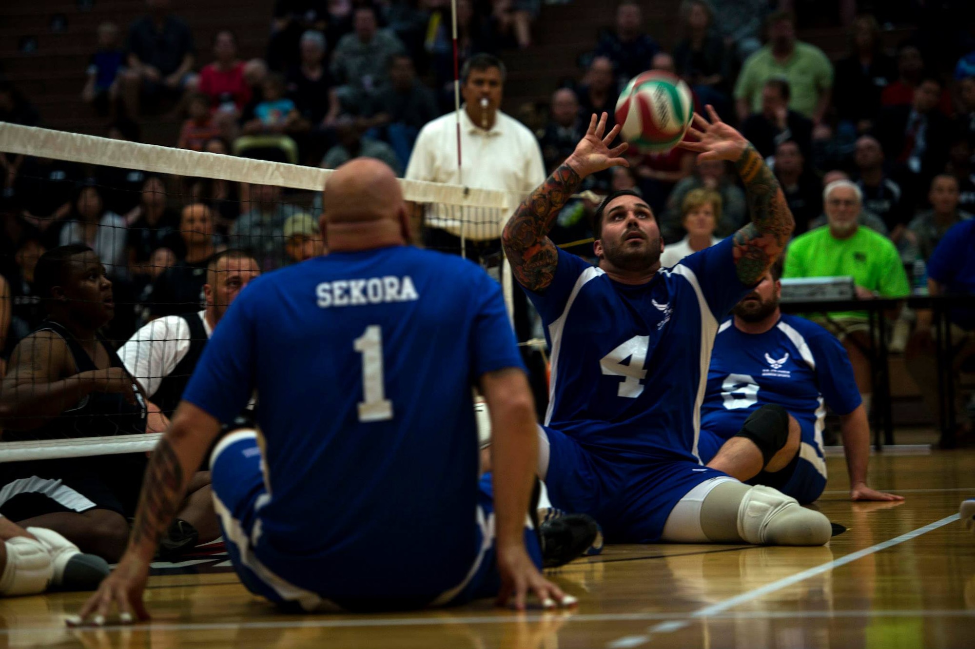Air Force wounded warrior Stephen Malits hits a volleyball during a game of sitting volley ball against the Army wounded warrior team at the Olympic Training Center in Colorado Springs, Colorado, Sept. 28th, 2014. The 2014 Warrior Games features wounded athletes from throughout the Department of Defense who compete in Olympic style events for their respective military branch. The goal of the games is to help highlight the limitless potential of warriors through competitive sports.(U.S. Air Force photo by Airman 1st Class Scott Jackson) 