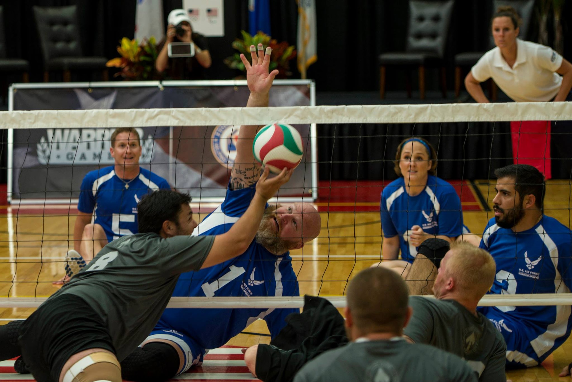 The U.S. Air Force team blocks a ball during a match of sitting volleyball at the opening day of the Wounded Warrior Games September 28, 2014 at the Olympic Training Center in Colorado Springs, Colorado. The 2014 Warrior Games features wounded athletes from throughout the Department of Defense who compete in Olympic style events for their respective military branch. The goal of the games is to help highlight the limitless potential of warriors through competitive sports. (U.S. Air Force photo by Airman 1st Class Taylor Queen) 