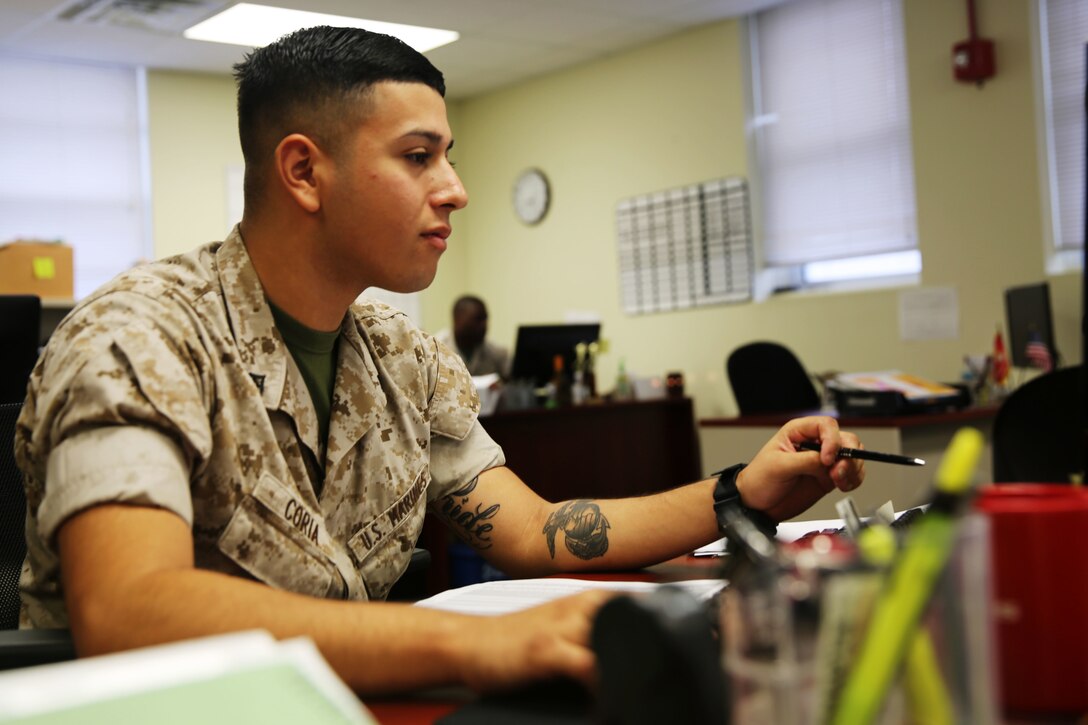 Lance Cpl. Emmanuel Coria works in the deployments section of the Installation Personnel Administration Center at Marine Corps Air Station Cherry Point, N.C., Sept. 25, 2014. Coria is an administrative specialist with Headquarters and Headquarters Squadron and is native of Salinas, Calif.