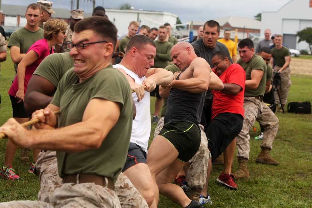 Ten Marines with Headquarters and Headquarters Squadron face off in a tug-of-war match against 10 from Marine Wing Headquarters Squadron 2 at Marine Corps Air Station Cherry Point, N.C., Sept. 26, 2014. The tug-of-war was the final event and decided the winner of the closely contested 2014 Fall Field Meet between H&HS and MWHS-2. H&HS pulled their way to victory and claimed their second straight title as field meet champions against MWHS-2.