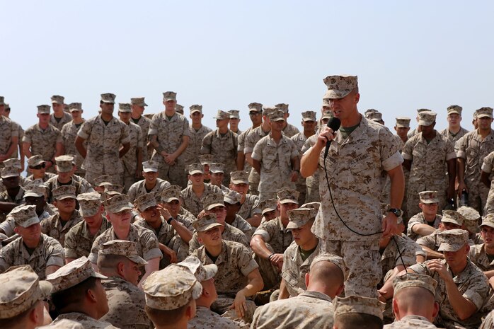 Col. Matthew Trollinger, commanding officer of the 11th Marine Expeditionary Unit, addresses Marines embarked aboard the USS Comstock during a visit, Sept. 27. The 11th MEU is deployed with the Makin Island ARG as a theater reserve and crisis response force throughout U.S. Central Command and the U.S. 5th Fleet area of responsibility. (U.S. Marine Corps photo by Sgt. Melissa Wenger/ Released)