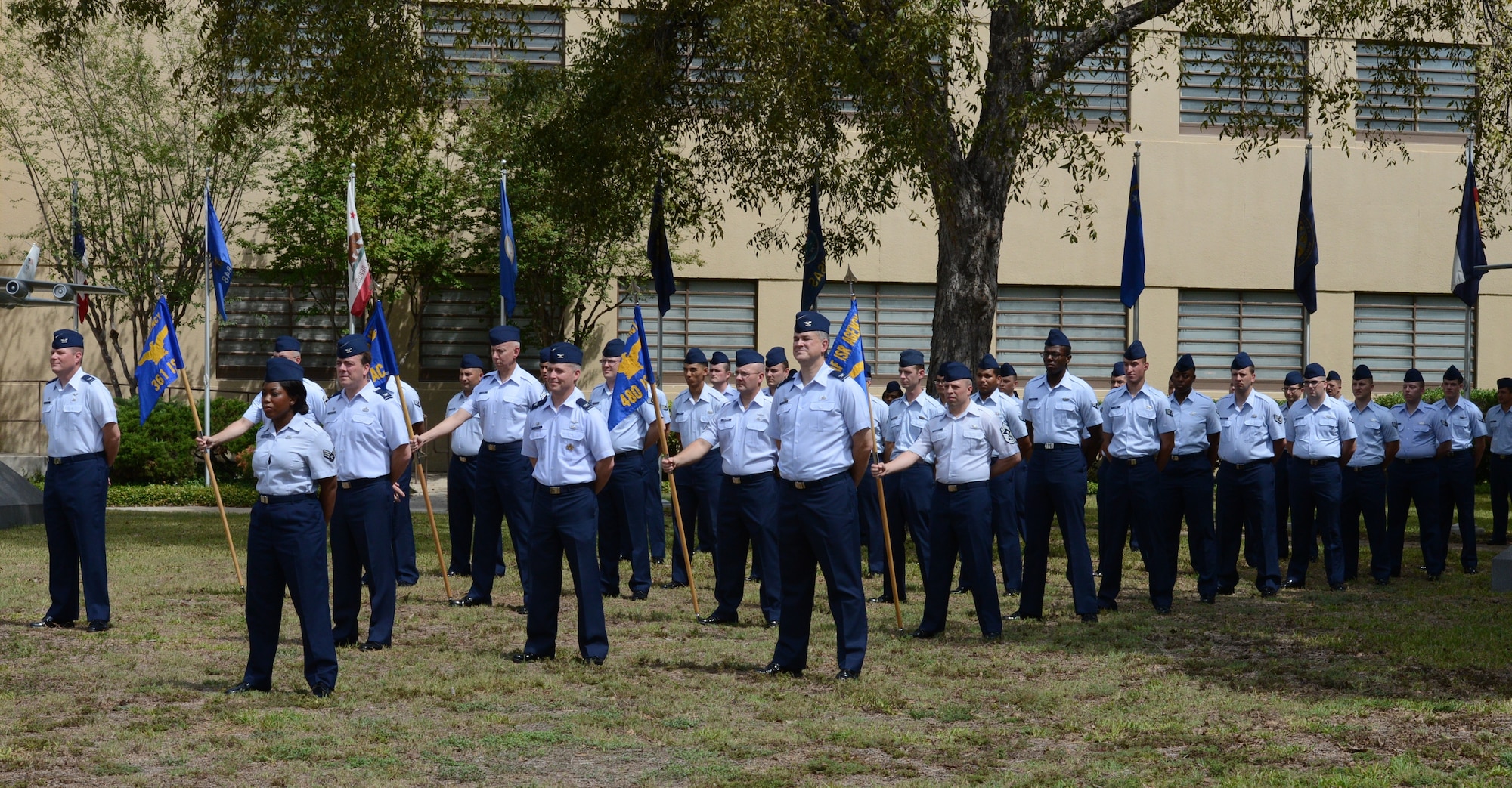 A formation of Air Force Intelligence, Surveillance and Reconnaissance Agency 'Silent Warriors' stands at parade rest in the Ardisana Courtyard during the re-designation ceremony of the agency as Twenty-Fifth Air Force Sept. 29 on Joint Base San Antonio - Lackland's Security Hill. (U.S. Air Force photo by Master Sgt. Andrew Leonhard)