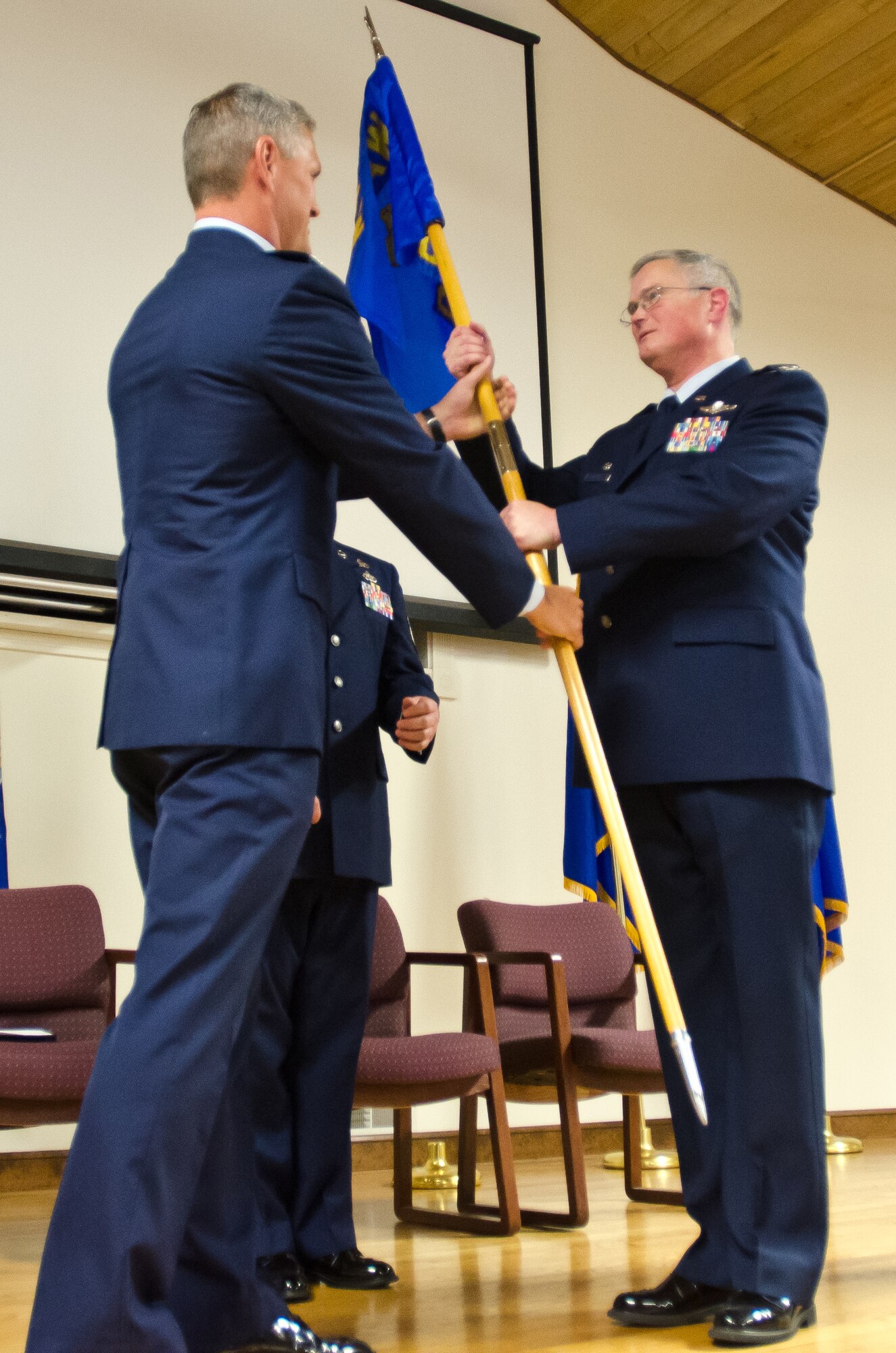 Col. David Mounkes assumes command of the 123rd Contingency Response Group as he accepts the unit’s guidon from Col. Barry Gorter, commander of the 123rd Airlift Wing, during a change-of-command ceremony held at the Kentucky Air National Guard Base in Louisville, Ky., July 12, 2014. Mounkes replaces Col. Mark Heiniger, who is the new director of operations at Headquarters, Kentucky Air National Guard. (U.S. Air National Guard photo by Senior Airman Joshua Horton)