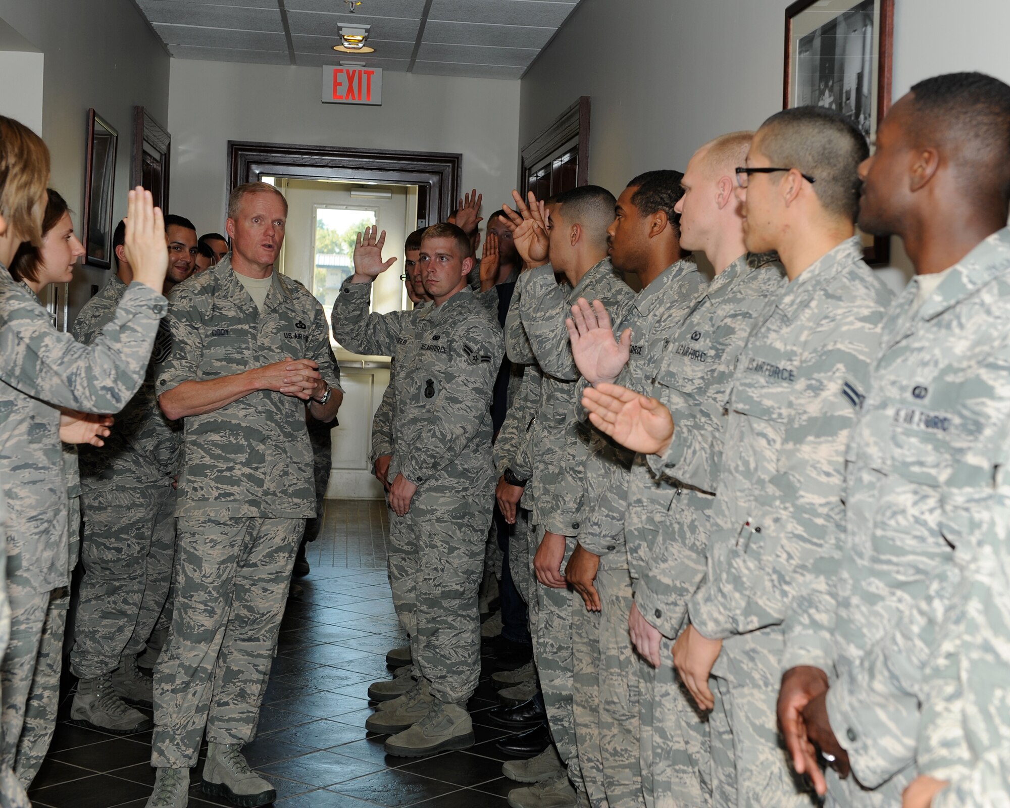 Chief Master Sgt. of the Air Force James Cody speaks with 14th Flying Training Wing Honor Guard members Sept. 24 during his visit to Columbus Air Force Base, Mississippi, Sept. 24-25. Cody and his wife, retired Chief Master Sgt. Athena Cody, took time to meet with Team BLAZE Airmen and discuss several of the Air Force’s current hot topics during the visit. (U.S. Air Force photo/Elizabeth Owens)