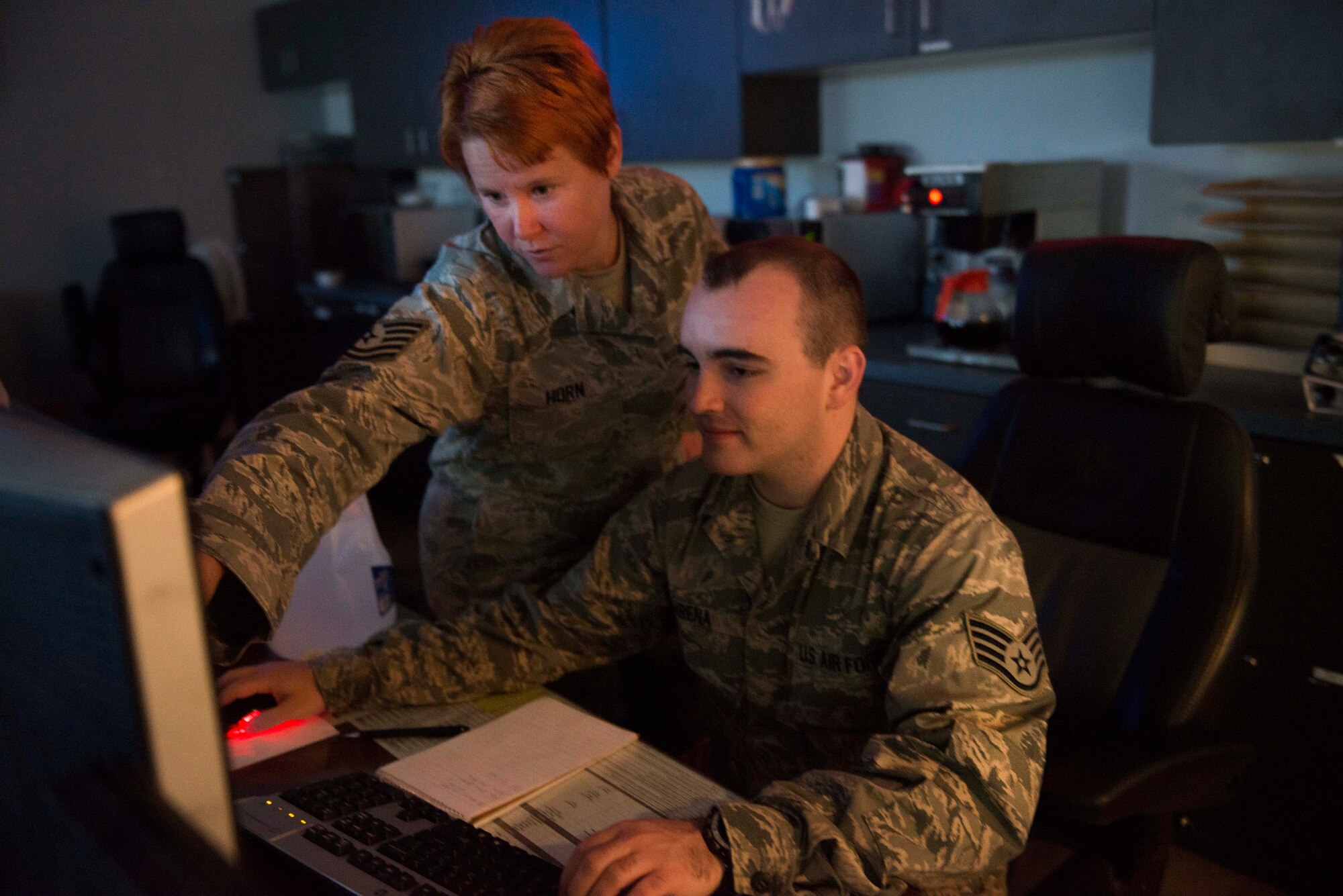 Tech. Sgt. Natasha Horn, 91st Missile Maintenance Operations Center assistant NCO in charge, and Staff Sgt. William Arena, 91 MMOC senior ICBM weapon system controller, monitor maintenance activities in the missile field from the Wing Operations Center on Minot Air Force Base, N.D., Sept. 4, 2014. Maintenance Airmen in the WOC work with security forces Airmen to ensure the success of the missile wing mission. (U.S. Air Force photo/Airman 1st Class Lauren Pitts) 