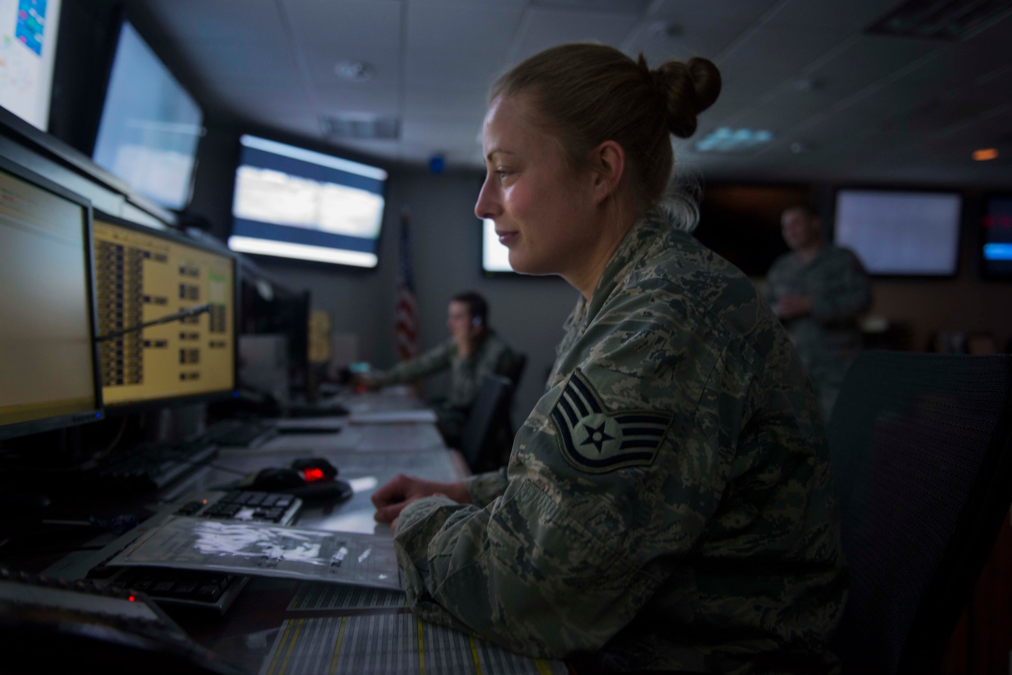 Staff Sgt. Fawn Williams, 91st Security Support Squadron missile security controller, monitors activities in the missile field from the Wing Operations Center on Minot Air Force Base, N.D., Sept. 4, 2014. Consisting of security forces and maintenance Airmen, the WOC oversees all operations in the missile complex. (U.S. Air Force photo/Airman 1st Class Lauren Pitts) 