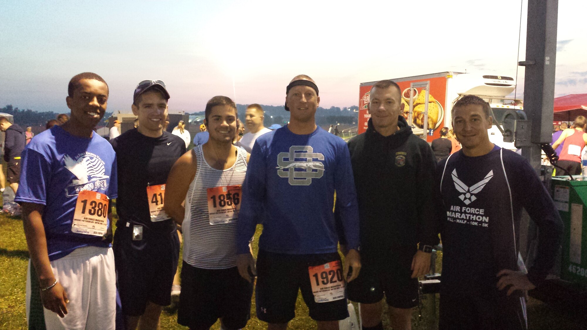 Five Keesler Airmen pose with Capt. Benjamin Shoptaugh (second from left) of Offutt Air Force Base, Neb. before the 18th annual Air Force Marathon held at Wright-Patterson Air Force Base, Ohio Sept. 20, 2014. From left, Senior Airman Martin Githui, Staff Sgt. Thomas Hutchins and Master Sergeants Brian Johns, Richard Crim, and Terrell Breaux represented Keesler at the marathon and each pledged to raise at least $500 for the Air Force Enlisted Village. (Courtesy photo)