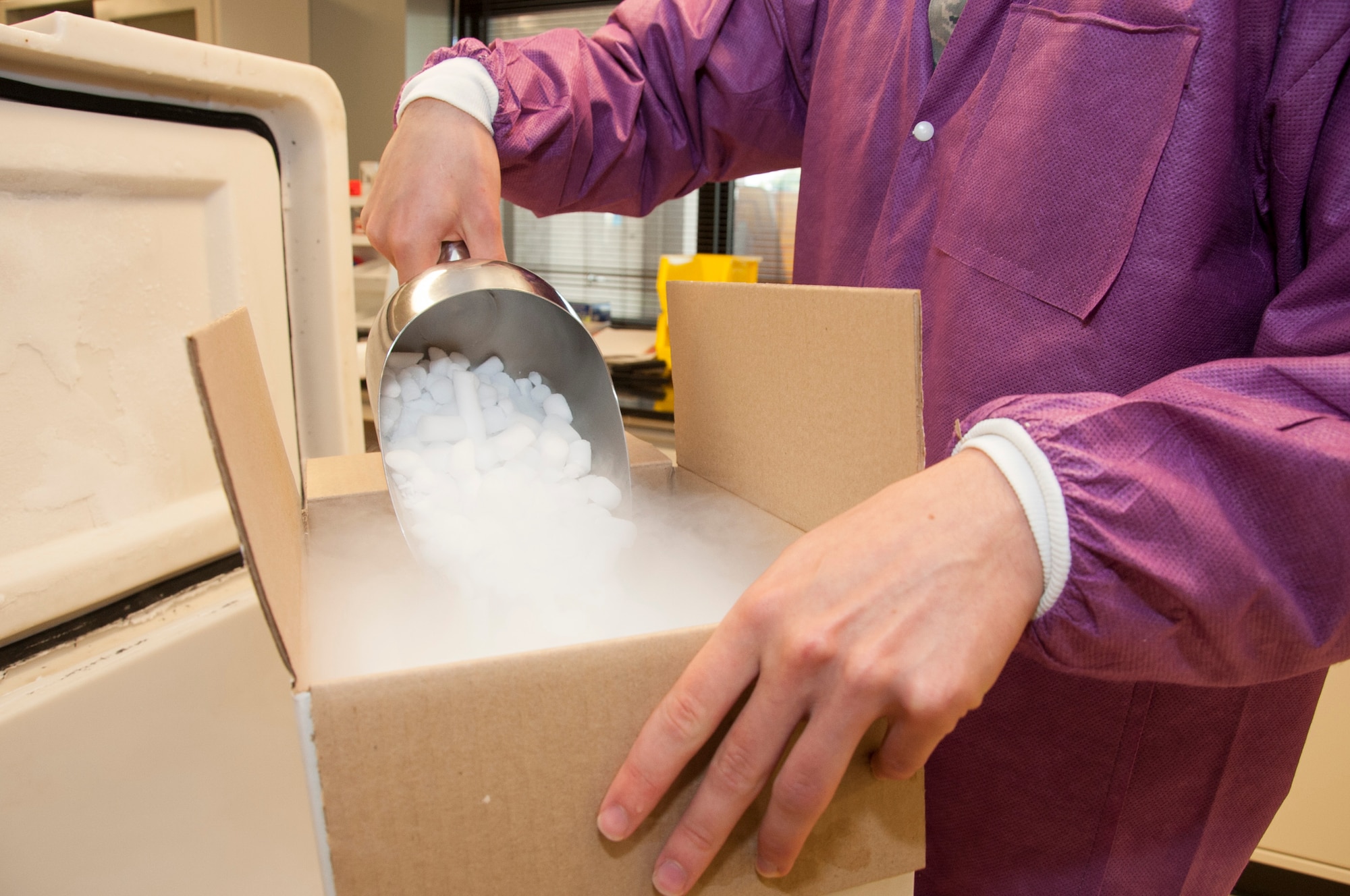 Airman 1st Class Micah Hurst, 436th Medical Support Squadron medical laboratory technician, packs specimens to be ships with dry ice Sept. 19, 2014, at the medical treatment facility on Dover Air Force Base, Del.  The lab techs send more than 15 boxes weekly to reference labs around the country to run tests that the lab does not have the capability to run. (U.S. Air Force photo/Senior Airman Jared Duhon)