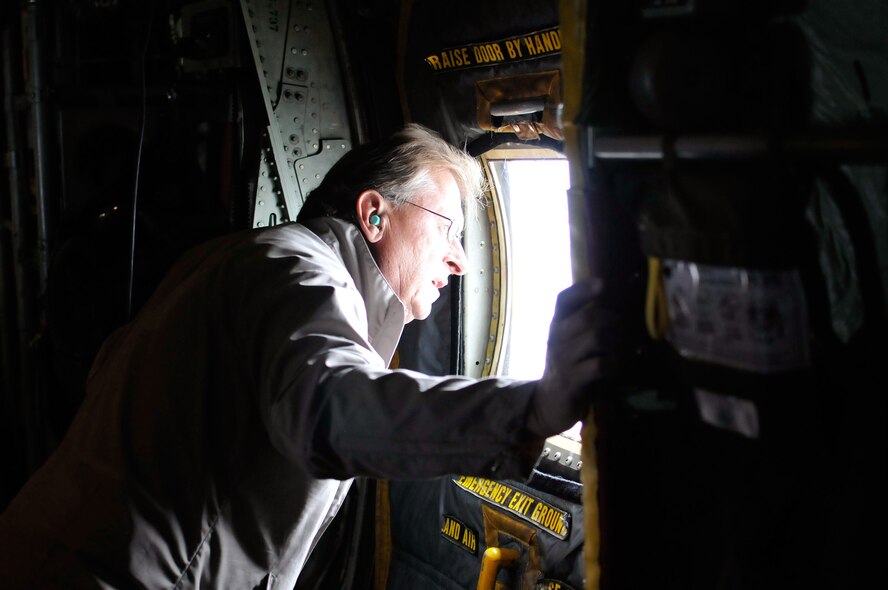 A civilian employer looks out the window of a C-130 Hercules during a familiarization flight at the Employer Support of the Guard and Reserve “Breakfast with the Boss” at the 182nd Airlift Wing in Peoria, Ill., Sept. 17, 2014. The attendees visited the base to see firsthand how their employees serve the Illinois’ reserve military and how employers play an important role in the defense of the nation. The Department of Defense established ESGR in 1972 to promote the relationship between service members and their civilian employers. (U.S. Air National Guard photo by Staff Sgt. Lealan Buehrer/Released)