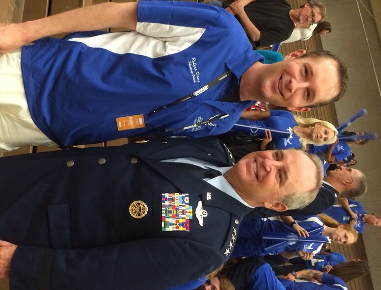 Air Force Chief of Staff General Mark A. Welsh III takes a photo with Special Agent Robert Davis, Det 212 commander, during opening ceremonies of the 2014 Warrior Games, Colorado Springs, Colo. SA Davis is a volunteer coach for Air Force athletes participating in this year's games.  