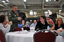 U.S. Air Force Col. William P. Robertson, commander of the 182nd Airlift Wing, visits with civilian employers during the Employer Support of the Guard and Reserve “Breakfast with the Boss” at the 182nd Airlift Wing in Peoria, Ill., Sept. 17, 2014. The attendees visited the base to see firsthand how their employees serve the Illinois’ reserve military and how employers play an important role in the defense of the nation. The Department of Defense established ESGR in 1972 to promote the relationship between service members and their civilian employers. (U.S. Air National Guard photo by Staff Sgt. Lealan Buehrer/Released)