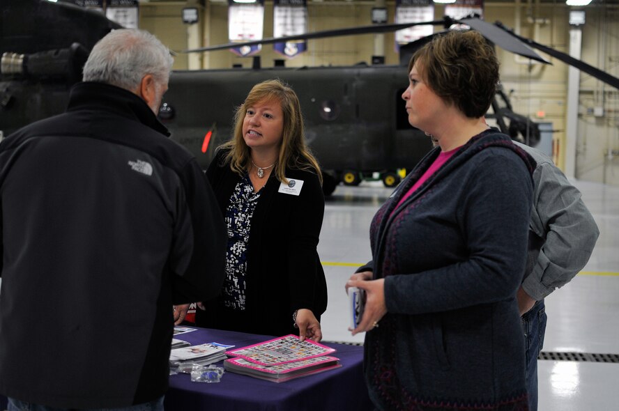 Christina Smith, a family assistance specialist, speaks with civilian employers during the Employer Support of the Guard and Reserve “Breakfast with the Boss” at the 182nd Airlift Wing in Peoria, Ill., Sept. 17, 2014. The attendees visited the base to see firsthand how their employees serve the Illinois’ reserve military and how employers play an important role in the defense of the nation. The Department of Defense established ESGR in 1972 to promote the relationship between service members and their civilian employers. (U.S. Air National Guard photo by Staff Sgt. Lealan Buehrer/Released)