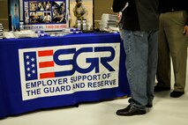 Civilian employers read literature during the Employer Support of the Guard and Reserve “Breakfast with the Boss” at the 182nd Airlift Wing in Peoria, Ill., Sept. 17, 2014. The attendees visited the base to see firsthand how their employees serve the Illinois’ reserve military and how employers play an important role in the defense of the nation. The Department of Defense established ESGR in 1972 to promote the relationship between service members and their civilian employers. (U.S. Air National Guard photo by Staff Sgt. Lealan Buehrer/Released)