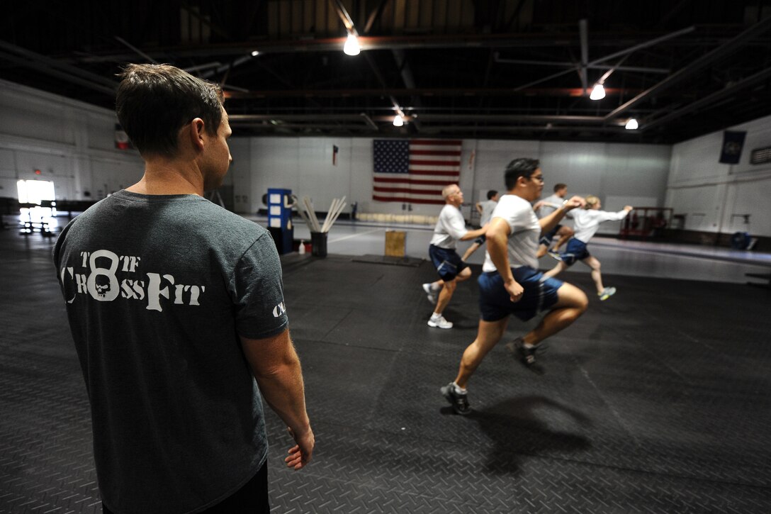 Members of Team Offutt participate in a tactical fitness introduction course during Comprehensive Airman Fitness Day Sept. 26 at the Offutt Field House.  The CAF day consisted of numerous physical activities throughout the day.  (U.S. Air Force photo by Josh Plueger/Released)