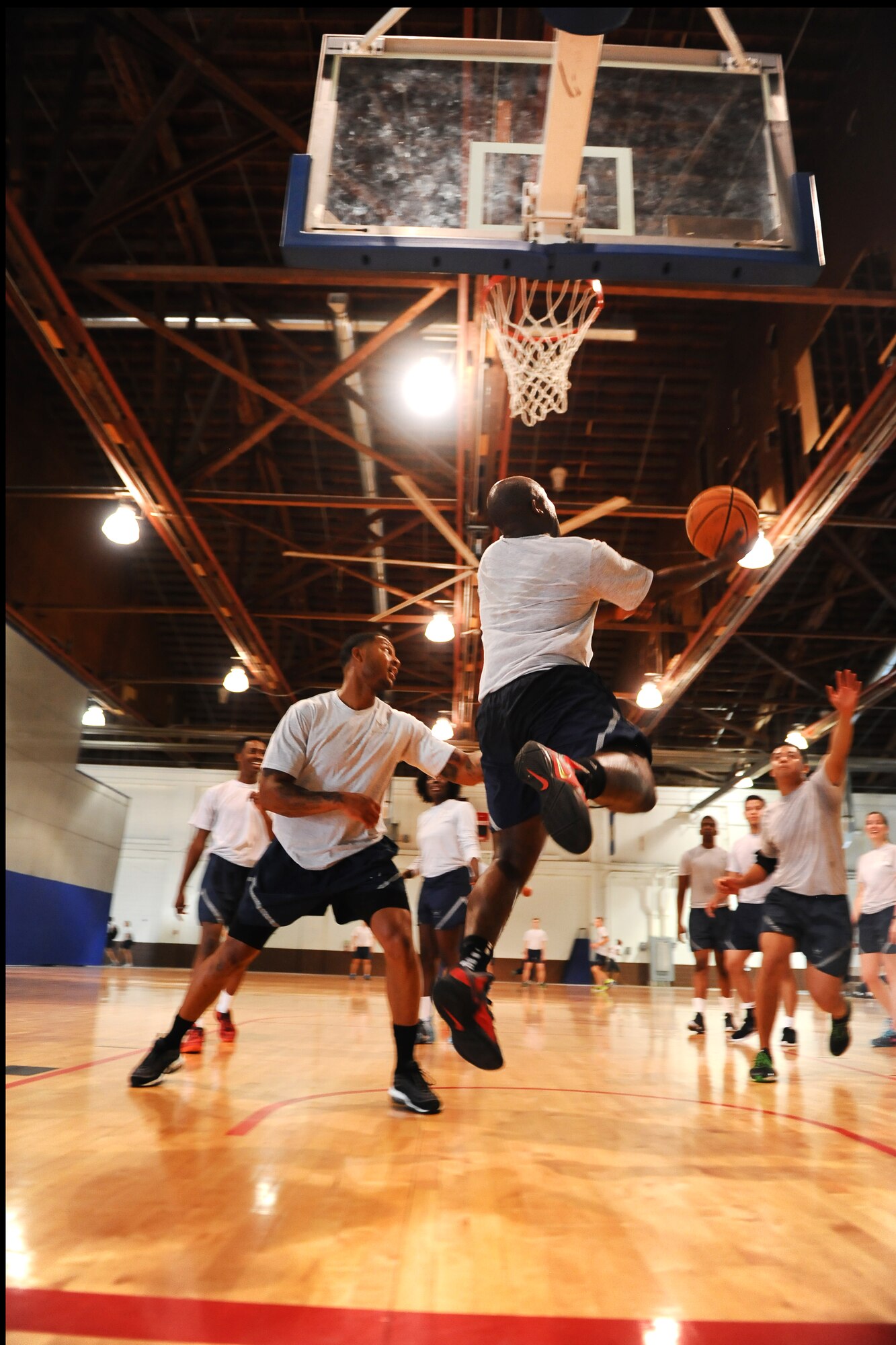 U.S. Air Force Staff Sgt. Steve Edwards, 55th Logistics Readiness Squadron, works his way around the hoop while playing basketball during Comprehensive Airman Fitness Day Sept. 26, at the Offutt Field House.  This CAF day focused on the physical pillar of Comprehensive Airman Fitness which consisted of numerous activities held throughout the day.  (U.S. Air Force photo by Josh Plueger/Released)