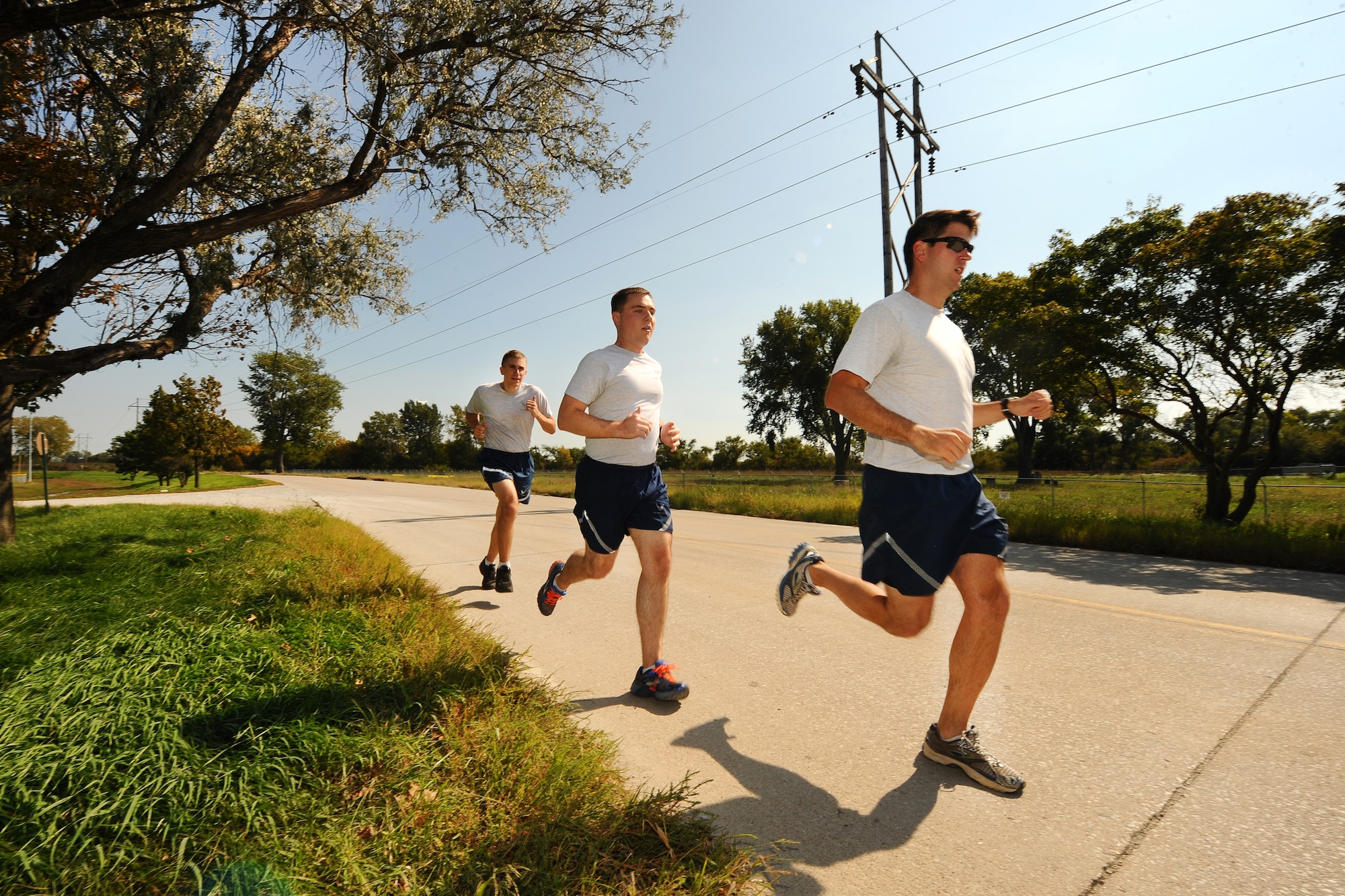 Members of the 338th Combat Training Squadron take part in a two-mile “Warrior Run” Sept. 26 on Offutt Air Force Base, Nebraska.  The Warrior Run was one of several Comprehensive Airman Fitness Day events held throughout the day at both the Offutt Field House and neighboring softball field complex.  (U.S. Air Force photo by Josh Plueger/Released)