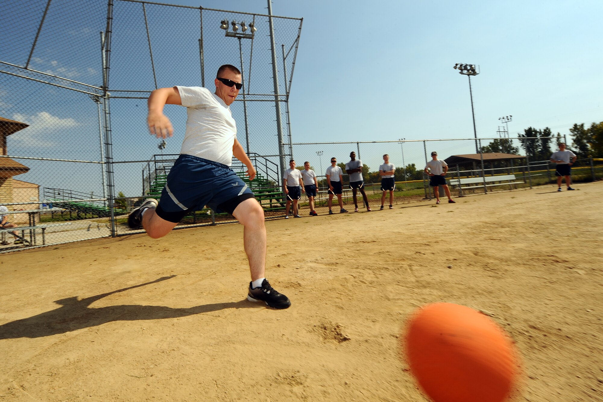 U.S. Air Force Airman 1st Class Alexander Corl, 338th Combat Training Squadron student, plays kickball as part of Comprehensive Airman Fitness Day Sept. 26 on the softball field.  Physical fitness, one of the four pillars of Comprehensive Airman Fitness, was the theme of the third CAF day event held this calendar year.  The four pillars of Comprehensive Airman Fitness are spiritual, mental, social and physical.  (U.S. Air Force photo by Josh Plueger/Released)