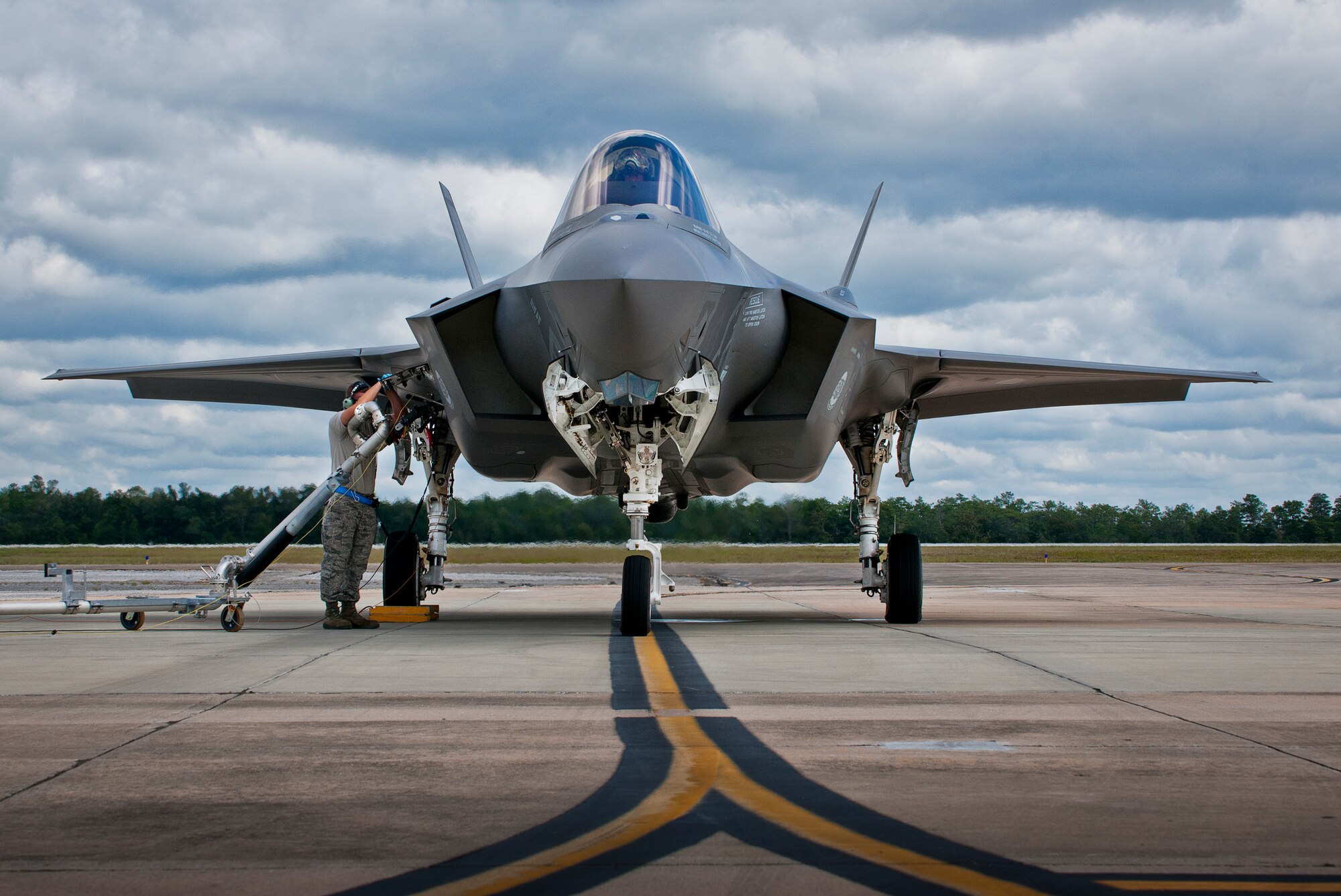 Staff Sgt. Chris Hunter, 33rd Aircraft Maintenance Squadron, refuels Maj. Gen. Jay Silveria’s, U. S. Air Force Warfare Center commander, F-35A Lightning II at a hot pit session during the general’s final qualifying flight Sept. 26 at Eglin Air Force Base, Fla.  Silveria became the first general officer in the Department of Defense to qualify in the fifth generation fighter.  He completed his training with back-to-back flights and hot pit refueling.  (U.S. Air Force photo/Samuel King Jr.)