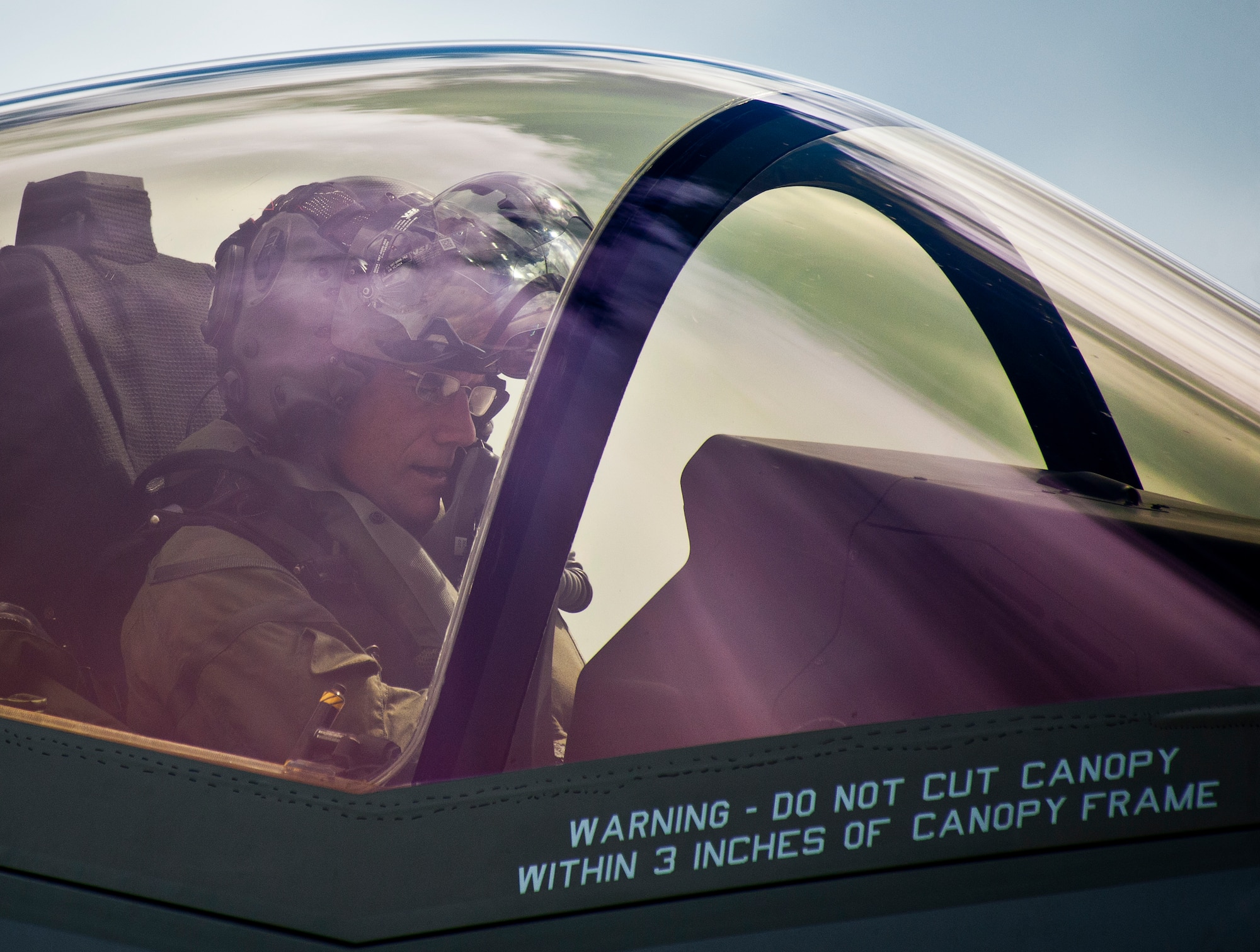 Maj. Gen. Jay Silveria, U. S. Air Force Warfare Center commander, takes a break in his F-35A Lightning II while the aircraft is refueling during his final qualifying flight Sept. 26 at Eglin Air Force Base, Fla.  Silveria became the first general officer in the Department of Defense to qualify in the fifth generation fighter.  He completed his training with back-to-back flights and hot pit refueling.  (U.S. Air Force photo/Samuel King Jr.)