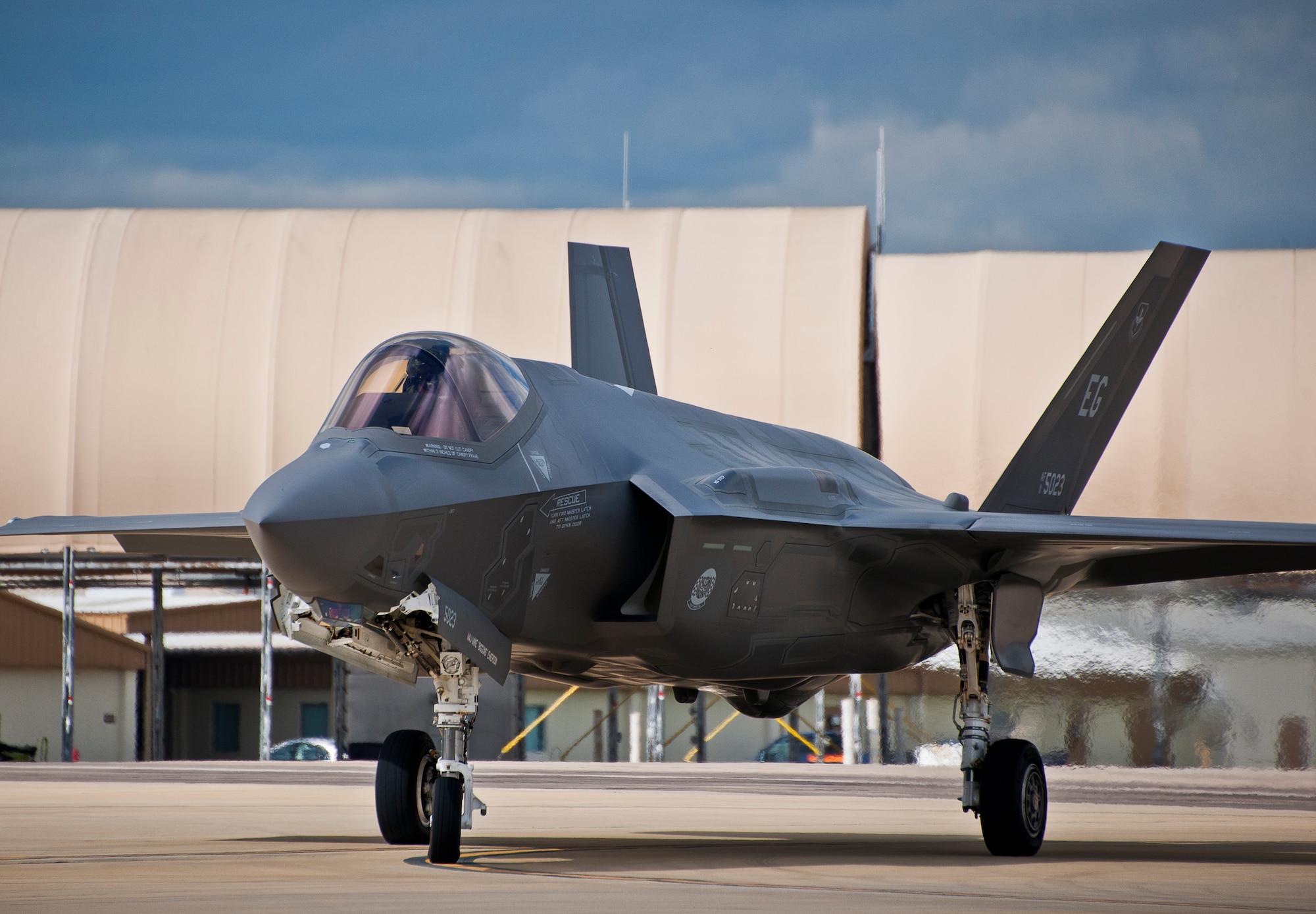 Maj. Gen. Jay Silveria, U. S. Air Force Warfare Center commander, steers his F-35A Lightning II along the yellow taxi line prior to a hot pit refueling session during his final flight qualification Sept. 26 at Eglin Air Force Base, Fla.  Silveria became the first general officer in the Department of Defense to qualify in the fifth generation fighter.  He completed his training with back-to-back flights and hot pit refueling.  (U.S. Air Force photo/Samuel King Jr.)