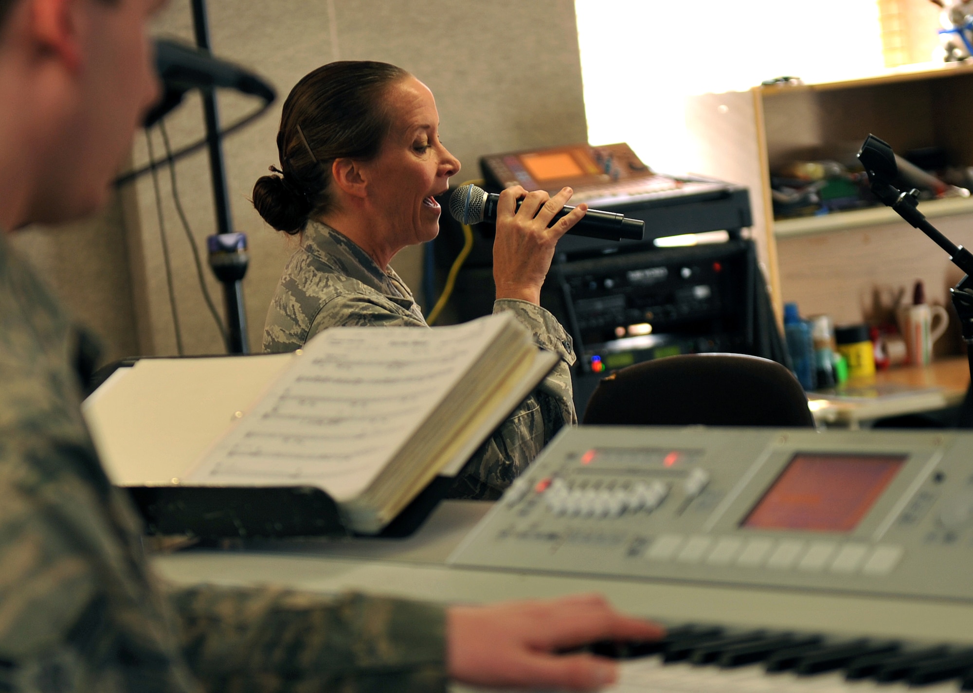 U.S. Air Force Tech. Sgt. Rebecca Packard, USAF Heartland of America Band vocalist, rehearses for an upcoming performance.  Packard is also the band’s First Sergeant. (U.S. Air Force photo by Jeff W. Gates/Released)