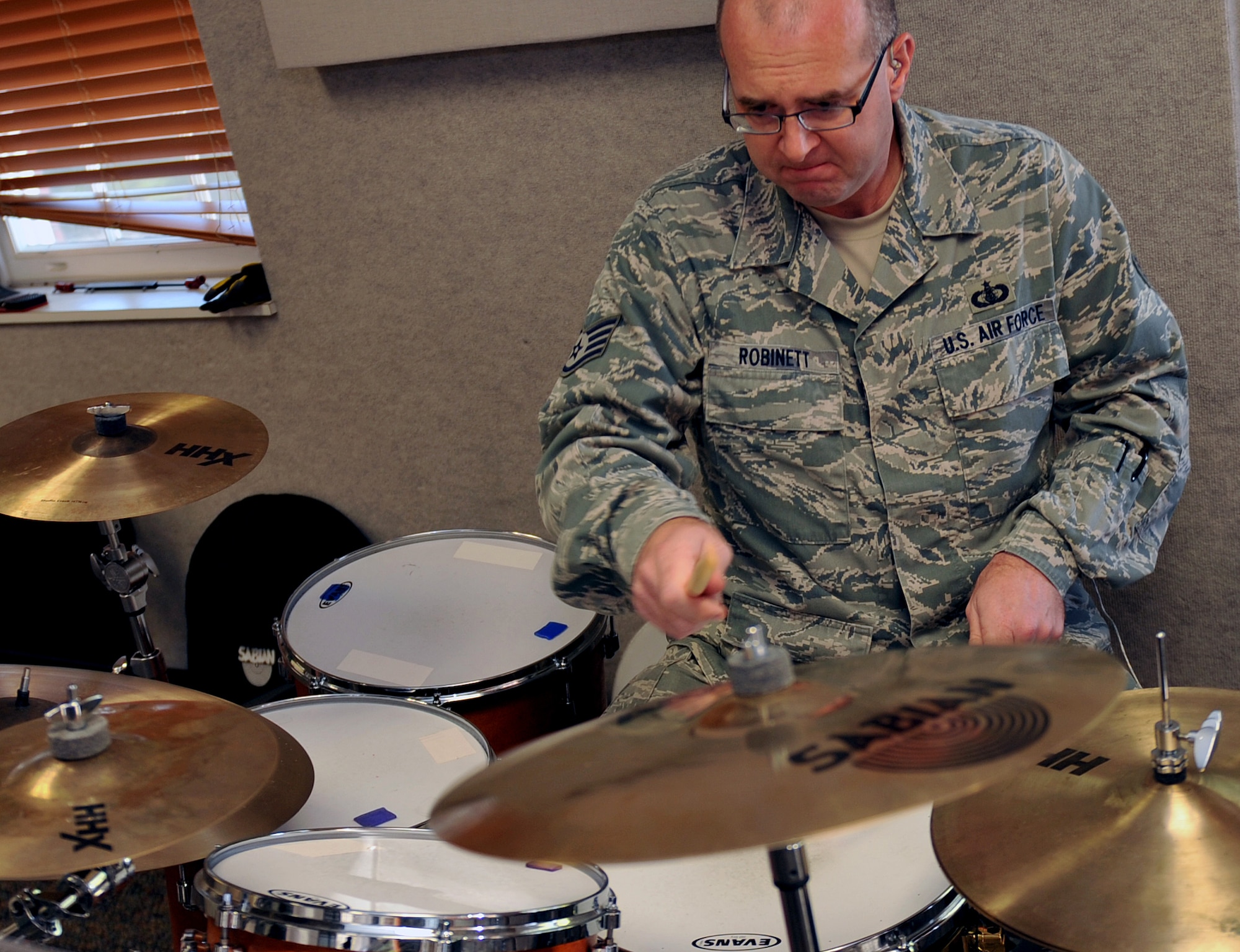 U.S. Air Force Tech. Sgt. Jarrett Robinett, USAF Heartland of America Band drummer rehearses for an upcoming performance. Band members are responsible for practicing individually and as a group.  (U.S. Air Force photo by Jeff W. Gates/Released)