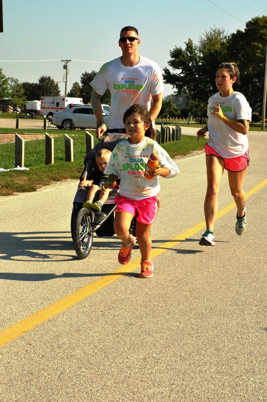 Members of Team Offutt cross the finish line at the Color Explosion Fun Run Sept. 27 at the Base Lake. The race was free and open to members of all ages. (U.S. Air Force photo by Staff Sgt. Rachelle Blake)