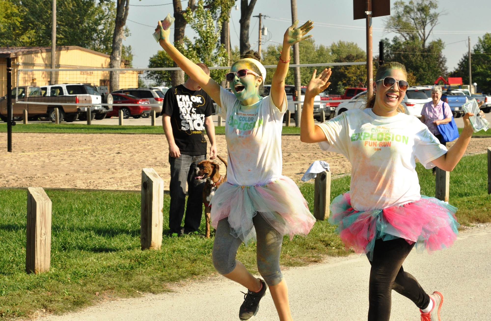 Members of Team Offutt celebrate finishing the Color Explosion Fun Run Sept. 27 at the Base Lake. The run was just over two miles. (U.S. Air Force photo by Staff Sgt. Rachelle Blake)