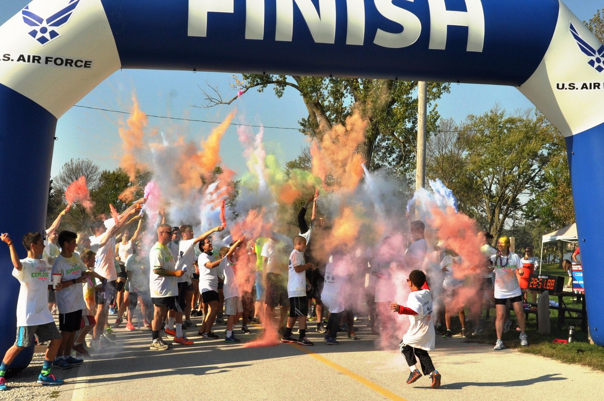 Runners throw color pouches into the air as part of the Color Explosion Fun Run finale Sept. 27 at the Base Lake. This was Offutt’s first color run. (U.S. Air Force photo by Staff Sgt. Rachelle Blake)